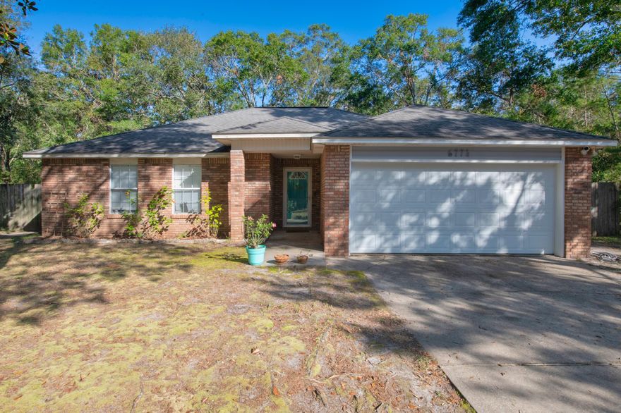 This 3-bedroom 2 bath home located in Navarre is move-in ready. The home features large bedrooms, tall ceilings and spacious lot. The kitchen provides plenty of cabinet space and a spacious breakfast bar. The master suite features double vanities, private shower as well as a walk-in closet. The living room leads out to the screened in patio and a private fenced in back yard. Just a short commute to Hurlburt Field, shopping or the Beaches.