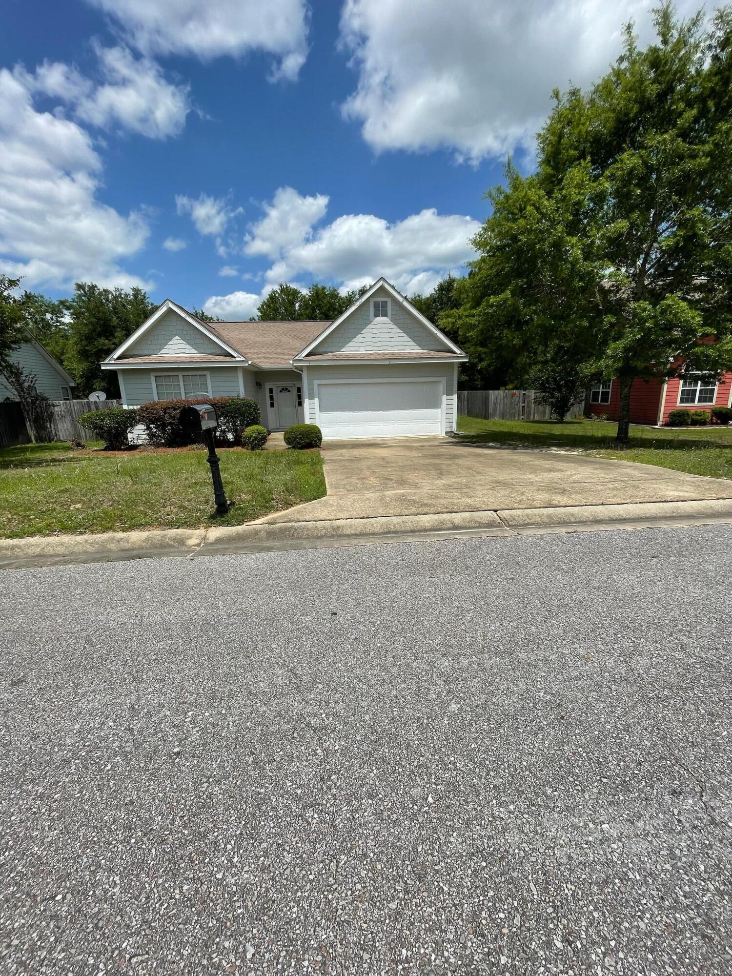 Rent this beautiful home on a 1 Acre Lot in South Crestview. This 4 Bed, 3 Bath has an open floor plan with 2 living areas, eat-in kitchen, and bar. Two of the four bedrooms are Master suites. There is a wonderful deck on the back of house overlooking the large wooded and fenced lot with a stream and fire pit. Located in the deed-restricted neighborhood of Sandy Ridge which includes friendly neighbors and a park for children to play. This home is on a quiet street with quick access to Duke field, Eglin, and 7th SFC. The large lot offers serenity and space to relax. Call today