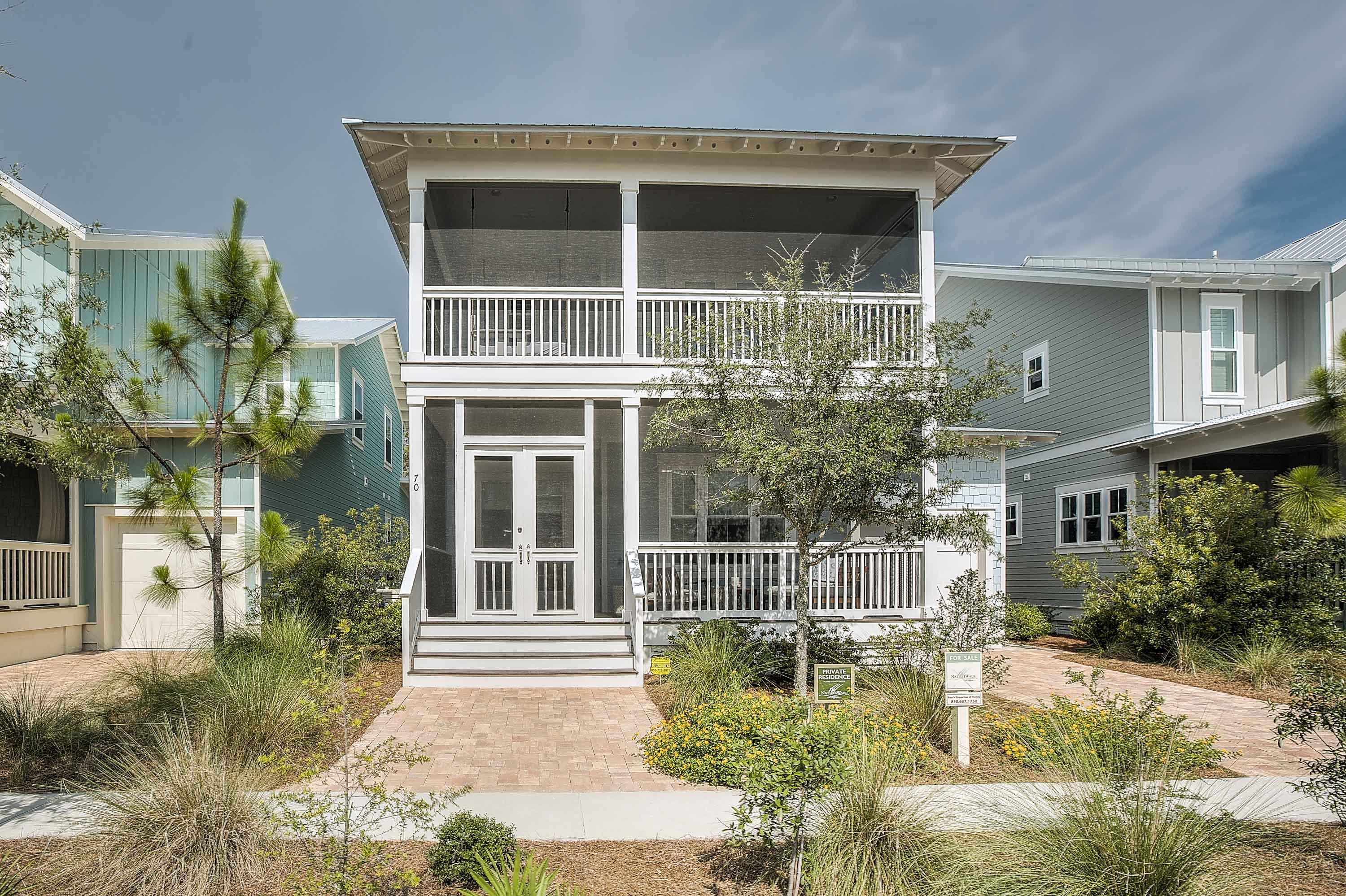 This beautiful Cottage home has it all- the location (close to Seaside & Watercolor), the perfect floor plan for entertaining, and offered furnished! All the hard work has been done for you- just bring your bathing suit and move right in! This 4 BR, 4 -1/2 BA home would be perfect for a full time resident or a 2nd home. Upgrades galore and attention to detail can be seen throughout the entire home. Walking through the double front doors you will see a great office/ dining area with custom made barn door. Then home opens up to an open kitchen, dining and living room with cottage trim on the walls and beautiful stained beams. Kitchen includes a GE Caf built in appliance package, white cabinets, granite, pull out shelving, etc! Through another se of double doors is your backyard oasis! Back porch is screened and furnished with teak furniture, outdoor heater, dining table, and more. Off the porch there is a paver area and fire pit. Ample space for a pool or additional outdoor amenities. This is the largest homesite on the private Beargrass Way and backs up to Preserve area for the utmost privacy! This Sandcastle floor plan is one of few plans with master suite on the 1st floor and 2nd floor! First floor master has large master bath with double sinks and vanity PLUS a HUGE closet with built in closet storage. Upstairs you will find a 2nd master plus additional bedroom, each with their own private baths , AND a wonderful LOFT area with double bunks and room for a seating/ play area- AND a full bath. This room has a barn door and could easily be a 4th bedroom. Upstairs 2nd master suite also has access to a huge private porch with swing bed already installed! Home is offered furnished with very few exclusions- no need to worry about window treatments, chandeliers, fans, furniture, rugs, etc- it's all here waiting for you! All porches have been screened and furnished very nicely! Home has dark stained yellow pine throughout! All this in beautiful NatureWalk at Seagrove. Come be close to all the action but off the beaten path for a little relaxation. Community has wonderful amenities and low HOA dues. The Gathering Place- NatureWalk's amenity center includes: resort style beach entry pool, heated lap pool, children's pool, tot lot, grills, fire pit, bar area, etc. In addition the community offers a shuttle to and from the beach Memorial through Labor Day, brand new sports court area AND a short cut path to the beach making it less than 1 mile!! Come see this upscale beach cottage today- it won't last long!