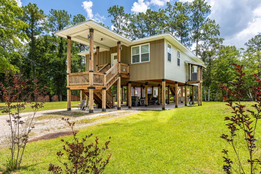 Owner Builder, Custom Built - Waterfront Florida Cottage on Alaqua Creek.Qualifies for 100% USDA Financing!This MUST SEE one-of-a-kind, custom waterfront home, designed by Designs by Vision, showcases exceptional craftsmanship and innovation. It features the patented Ty-Rite System, a revolutionary piling installation method where no wood touches the ground, ensuring superior durability and longevity. This system makes this home stronger than any other wood-pile waterfront home in the area! The home is elevated on wood pilings with a solid concrete foundation, enhancing flood protection, promoting air circulation beneath the structure, and significantly reducing long-term maintenance costs. The elevation also provides ample space to store a 20' boat and park up to four vehicles. Enjoy stunning views of Alaqua Creek from the spacious 10' x 20' covered porch, complete with custom steel-capped handrails. Inside, the open-concept living and kitchen area with an island offers incredible waterfront views. and is outfitted with custom solid wood cabinetry built from ?? inch poplar wood, finished with crown molding. The kitchen features 1.5" thick granite countertops, a large island, 9' ceilings with crown molding, waterproof vinyl wood flooring throughout, LED lighting, and Whirlpool appliances. The home is equipped with a 2 Ton Carrier HVAC system with heat pump (14 SEER) for year-round comfort. 

Bathrooms include custom solid wood vanities, granite countertops, and ceramic tile flooring. Exterior features include Hardy board front siding, 29-gauge steel metal roofing and siding, a mound septic system, and a 4" well with two advanced filtration systems to ensure clean, safe water. The home is also pre-plumbed for an outdoor shower, perfect for rinsing off after fishing or watersports days or gardening. Recently pressure washed, the home is designed for low maintenance and watertight performance. 

Affordable home on deep water that goes out to the Bay! Located near the Alaqua Creek Park Public Boat Launch, this property offers direct and quick access to Choctawhatchee Bay.  No comparable homes in the area for this price. Homeowners and Flood insurance is very affordable, and utility bills remain low! 

 Best of all, there are no HOA fees or restrictions