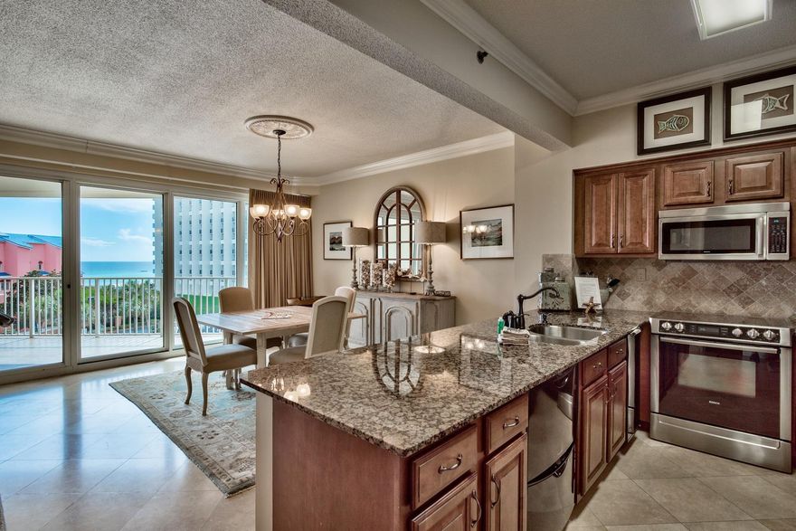 Beautifully appointed 2 bedroom 2 bath condo in the sought after Tides condominium building in Tops'l Resort is ready to take beach living to a new level. Located on the sugar white sand and emerald green water of the Gulf of Mexico, this fully furnished 1,230 square foot unit with tile flooring throughout, boasts an updated kitchen complete with granite counters and stainless steel appliances which opens to a spacious living and dining area. Step outside to the large balcony, the perfect spot to relax after a day at the beach. The master bedroom is decorated in soft, tranquil colors and offers an updated ensuite bath with dual sinks, soaking tub, and separate shower. The ample sized guest room, along with an additional bathroom, makes this an excellent rental investment opportunity.