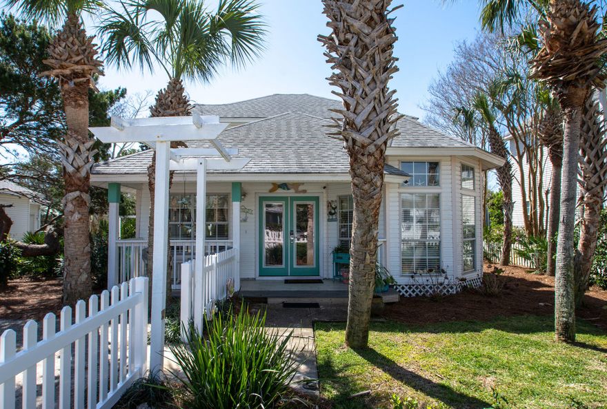 Cute as can be and ready as your primary residence, second home or investment property!  Located in popular Crystal Beach, this three bedroom, two bath cottage is just a short stroll or golf cart ride to the beach and is just across the street from the community pool.  Open floor plan with cathedral ceilings in living and dining, granite counters, master on the main, two bedrooms upstairs.  Tile and hardwood floors throughout, no carpet!  Covered front and back porches, second level balcony accessible from both bedrooms, third level observation deck, fenced in yard. Other features include Rennai hot water heater, new AC installed last summer, owner's closet.  Seller is in process of installing a new metal roof.  As always, all dimensions important to the buyer should be verified.