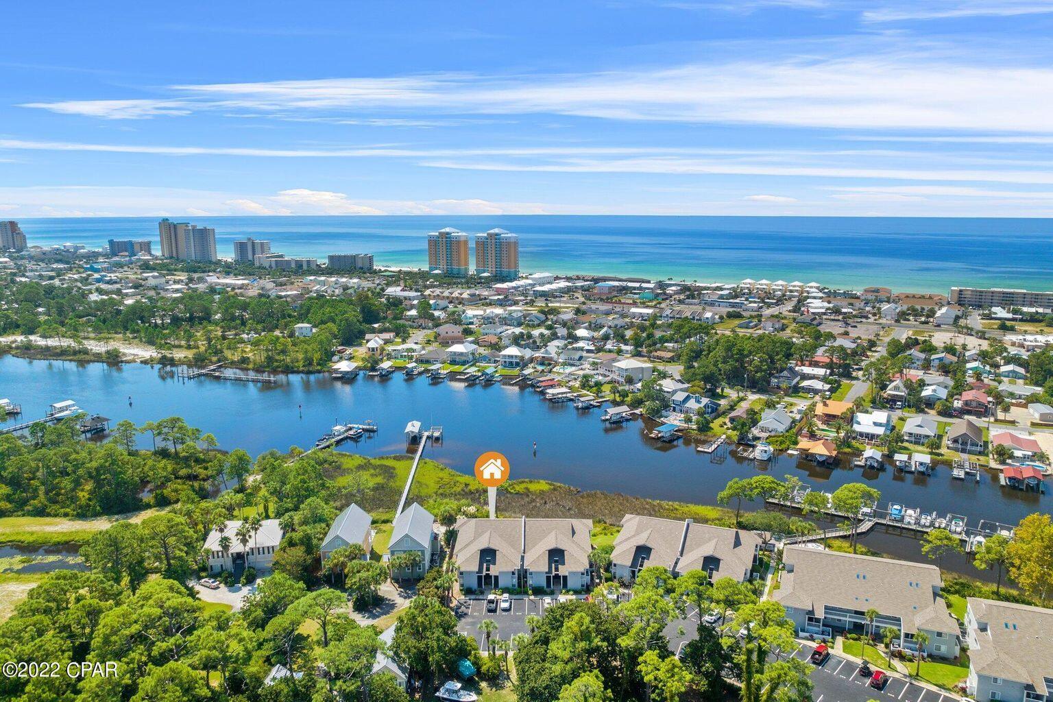 Located on the glistening waters of Grand Lagoon, you have discovered a custom and extensively remodeled condominium inclusive of a deeded boat slip outfitted with a new 10,000 lbs lift as part of the purchase. This top floor, corner unit received over $100,000 in recent improvements and is a rare find. Tour now before the tranquil views and exquisite coastal taste of this waterfront sanctuary belong to someone else.