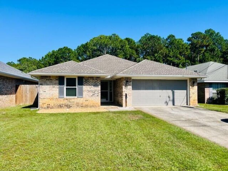3 bedroom 2 bath Pet Friendly home is located in a nice neighborhood, and is on the same block as the senior center & library, and close to schools, the beach, and shopping. The rear yard is privacy fenced and the property is nicely landscaped and includes a two car garage. The open floor plan has a nice flow with the great room and dining room combined, breakfast bar, updated kitchen, and laundry room, plant ledges, large master bedroom, walk in closet, master bath with a garden tub & separate shower and good sized spare bedrooms. This home is situated just minutes away from the beautiful white sand of Navarre Beach. Contact Navarre Beach Realty 850-936-0700 for more information. Pets allowed upon approval.