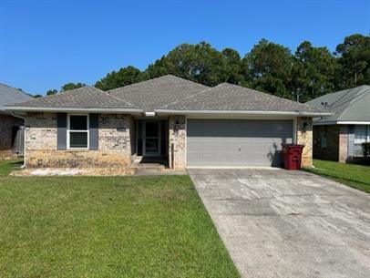 3 bedroom 2 bath Pet Friendly home is located in a nice neighborhood, and is on the same block as the senior center & library, and close to schools, the beach, and shopping. The rear yard is privacy fenced and the property is nicely landscaped and includes a two car garage. The open floor plan has a nice flow with the great room and dining room combined, breakfast bar, updated kitchen, and laundry room, plant ledges, large master bedroom, walk in closet, master bath with a garden tub & separate shower and good sized spare bedrooms. This home is situated just minutes away from the beautiful white sand of Navarre Beach. Contact Navarre Beach Realty 850-936-0700 for more information. Home is occupied until the end of August. Available to view the week of September. No weekend showings.