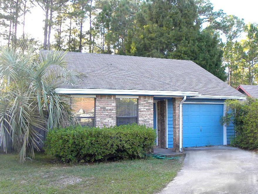 WHY RENT WHEN YOU CAN BUY? Spacious living area with high cathedral ceiling and tile flooring throughout. Dining area is open to the living room and has sliding glass doors leading out to the open patio perfect for cookouts. Kitchen has ample cabinets and counter space and room for a bistro table and chairs. Large master bedroom with tile flooring and the master bath has a extended vanity with make-up station and large mirror and double closets. Two additional bedrooms one of them has a sliding glass door to the side and backyard. Inside laundry room. Call today to take a look inside!!!