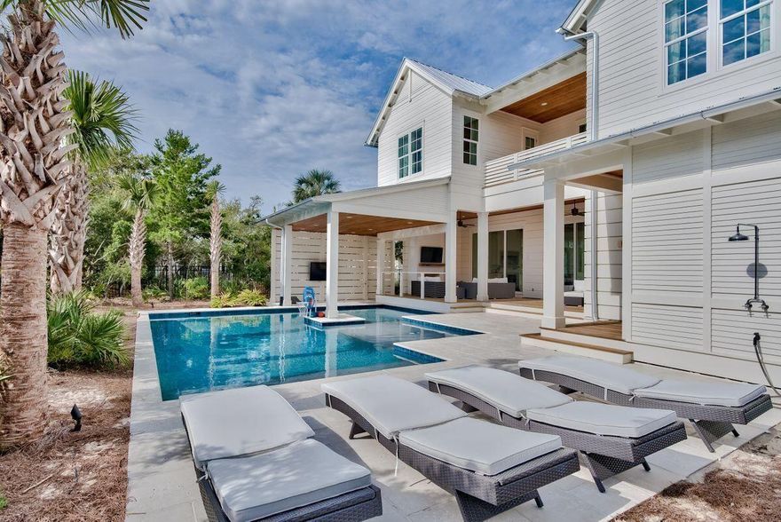 Located in the iconic Blue Mountain Beach, this over the top home is perfect for a 2nd home or vacation rental.  The outdoor living is exemplified by an oversized, heated pool that features a swim up bar, sun shelf, cabana, and outdoor fireplace.  Outdoors also includes a gas grill, ice maker, TV, and fridge. The home also has 12 foot ceilings on 1st floor,  rustic beams, shiplap, and gourmet kitchen. Buyer to verify all dimensions.