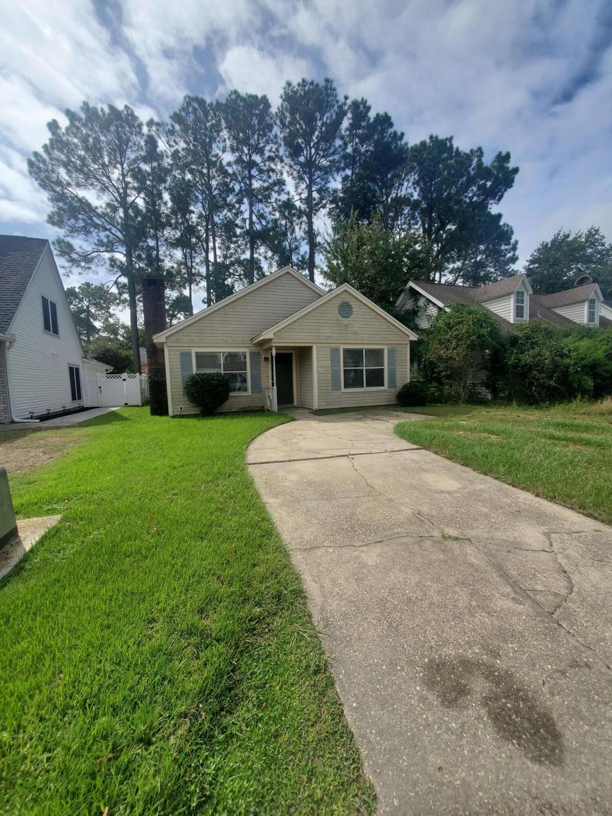 Get ready to fall in love with this delightful 2-bedroom, 2-bath cozy haven that's bursting with charm and potential! &#127969;&#10024; Home is dated/sold AS IS.  It features an open floor plan that seamlessly connects the dining and living areas--perfect for entertaining or relaxing by the wood-burning fireplace on cool evenings.&#127774; The kitchen offers a generous counter and cabinet space, plus a sun-kissed window that welcomes the glorious Florida light to start your mornings right. The layout is thoughtfully designed with both bedrooms separated by the bathrooms for added privacy. The spacious master suite sits proudly at the front, while the inviting guest bedroom offers a quiet retreat in the back.New roof possible w/full price offer.  Roof-2002 AC-2009 Wtr Htr-2008 Fridge-2020