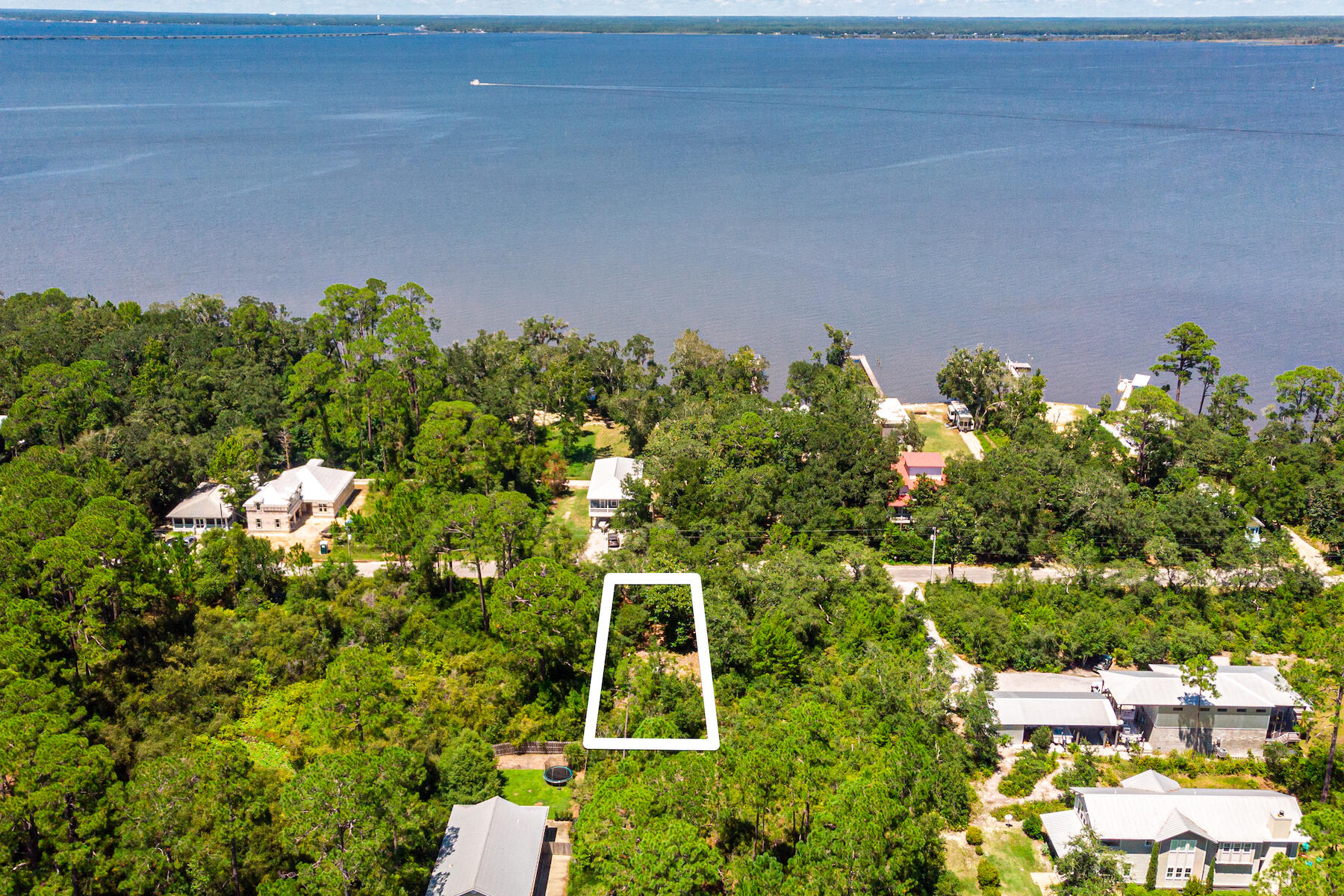 ***Under Contract with a 72 Hour Kick Out Clause. Nice, high and dry lot in highly desirable Point Washington neighborhood. Potential bay views from your custom-built home! No HOA or buildout time and less than 10 minutes to the white sandy beaches of Grayton Beach and shopping & restaurants along Scenic Hwy 30A. Boat ramp is located three streets away and the Bay is located two blocks away with a community bay-front park at the end of the street. This community is perfectly situated with ease of access to boating in the Choctawhatchee Bay or hopping on 98 and enjoying all that Pier Park or Destin have to offer.
