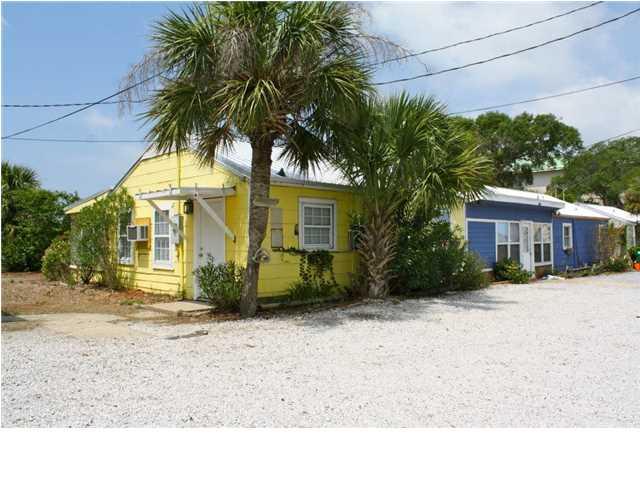 PRIME RE-DEVELOPMENT OPPORTUNITY!! 261 Feet on the Harbor in Destin. The property has 7 cottage style rental units that are currently leased month to month with 5% NET Return.