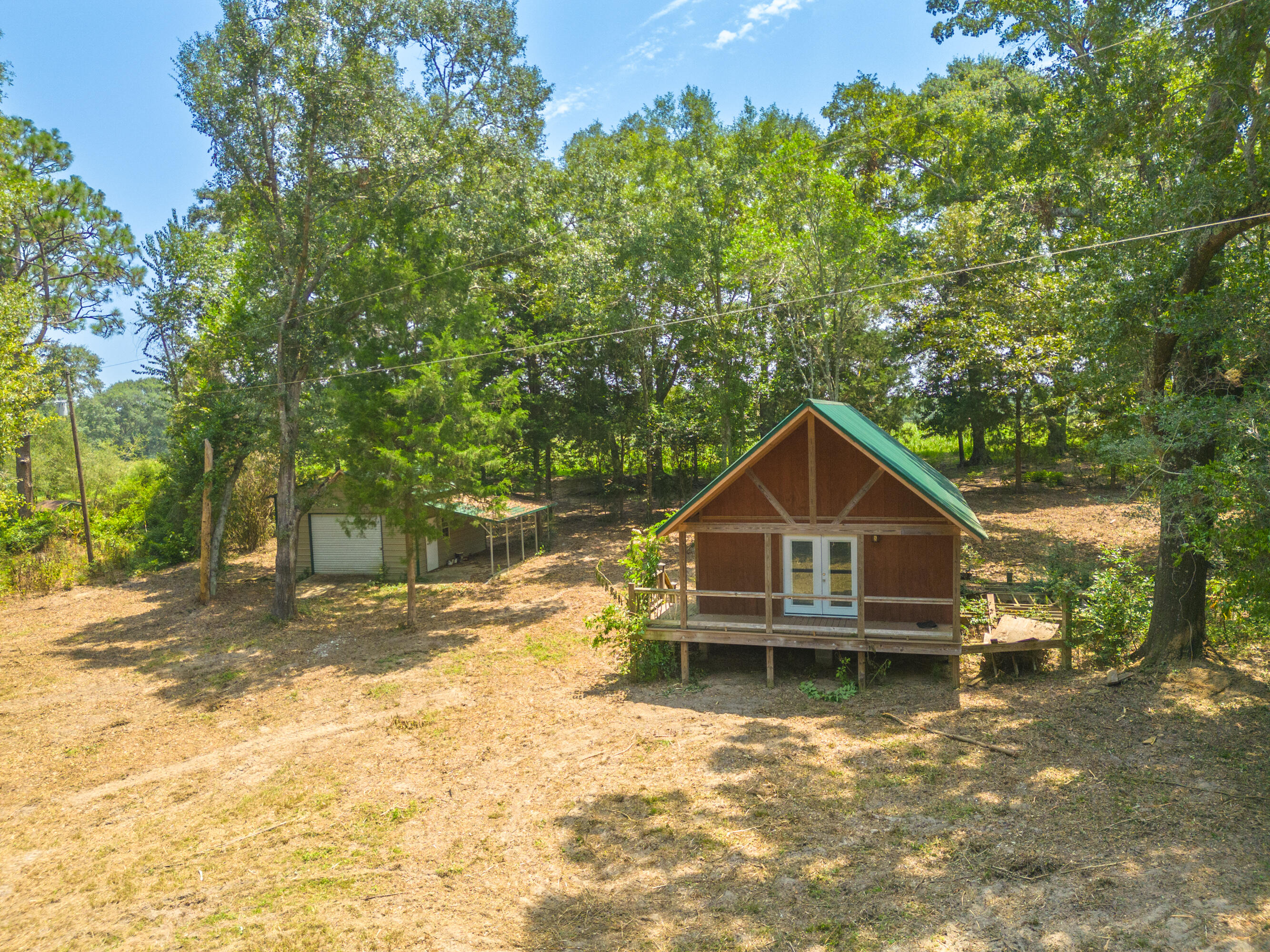 MULTIPLE OFFERS RECIEVED.. HIGHEST AND BEST DUE BY 5 PM 07/26/23.PRIMITIVE CABIN WITH LOFT.. NOW AVAILABLE.. AND THIS ONE IS SURROUNDED BY GASKIN FARMLAND AND PEACEFUL COUNTRY!This 2 bedroom/1 bath newer construction was started recently. but never completed. The owner built the shell.. framed all rooms.. and started the bathroom. The exterior is almost completely finished.. and boasts brand new roof. The interior is ready for you personal touch.Check out the rustic branches the builder used for the porch banister, and the quality craftsmanship that went into the porch. The views can not be described.. only experienced!!!BONUS: HUGE METAL WORKSHOP/SINGLE CAR DETACHED GARAGE ON SITE!