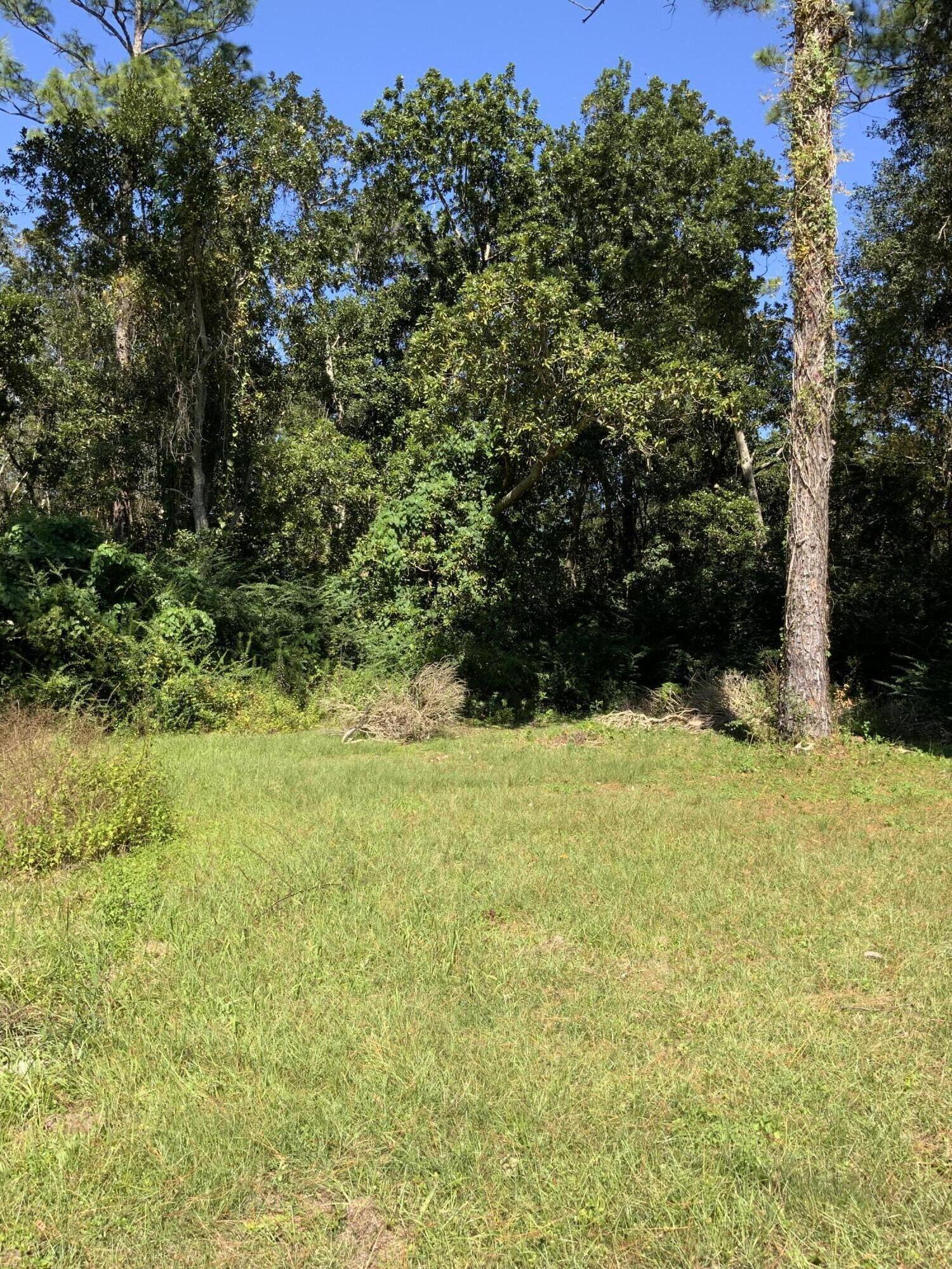 Bring us an offer on this vacant land approximately five minutes from I-10, shopping centers and grocery stores. Property backs up to a tranquil pond. It would be great for a new build or investment for future use.  Property is zoned MDR and partially wooded.MODULAR HOMES ALLOWED. NO manufactured or mobile homes
