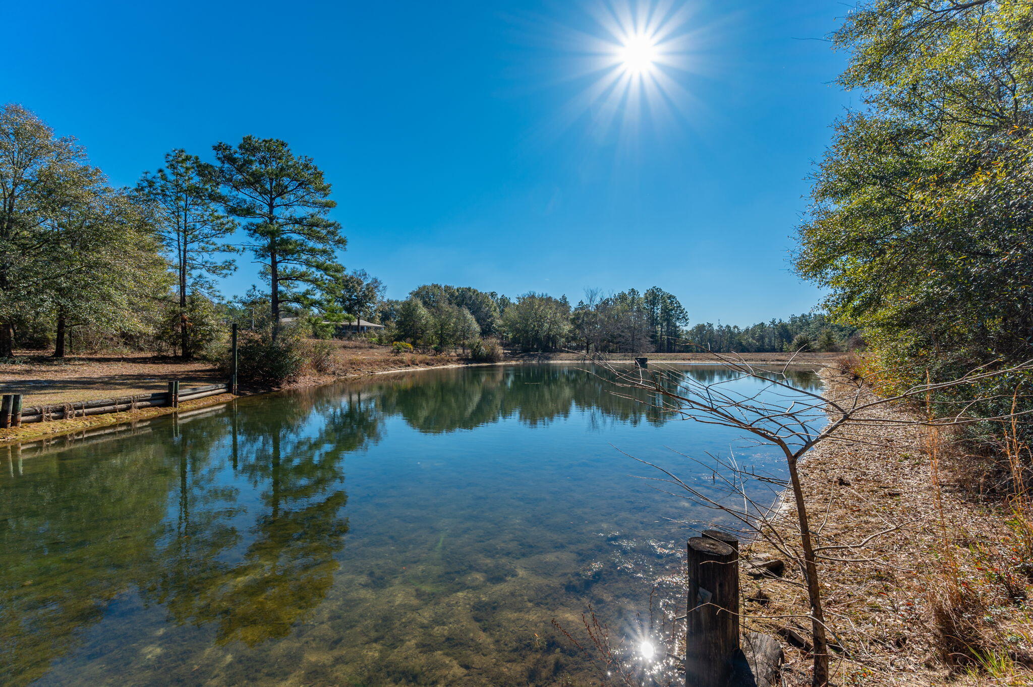 Bring your custom home blueprints and build your dream home on this 2.5 acre waterfront homesite, overlooking Lake Roberts in the Kennedy Lakes Subdivision. The front portion of the property is mostly cleared and ready to build on, with the remainder consisting of hardwoods and pines, affording you with privacy. Lake is spring fed with some of the seep being located on the property. Electric, water, septic, two culverts and a paved circular driveway are already in place. Natural gas is available. Park your RV on the property while you build! The dock, shared with the adjoining property owner, offers an impressive view of the lake.