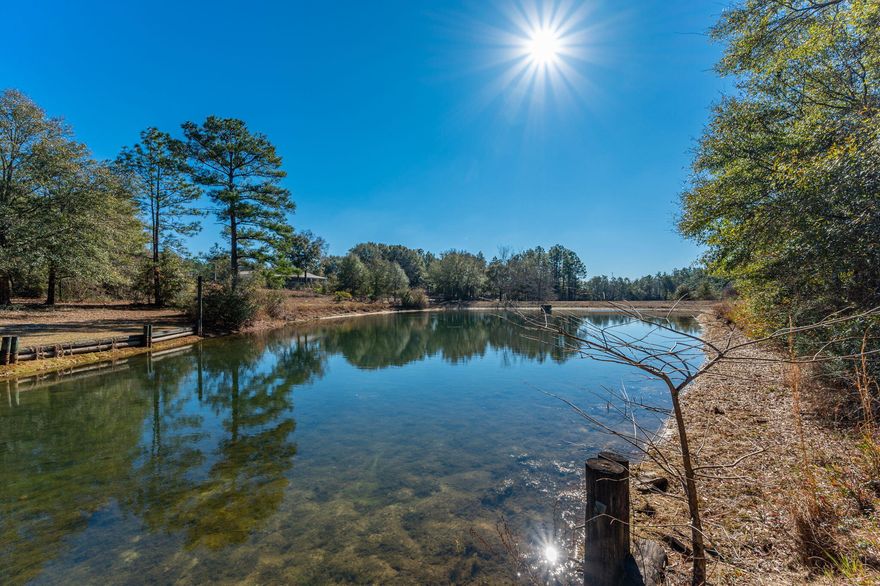 Bring your custom home blueprints and build your dream home on this 2.5 acre waterfront homesite, overlooking  Lake Roberts in the Kennedy Lakes Subdivision.  The front portion of the property  is mostly cleared and ready to build on, with  the remainder consisting of hardwoods and pines, affording you with privacy.  Lake is spring fed with some of the seep being located on the property.  Electric, water, septic,  two culverts and  a paved circular driveway  are already in place.  Natural gas is available. Park your RV on the property while you build! The dock, shared with the adjoining property owner, offers an impressive view of the lake.