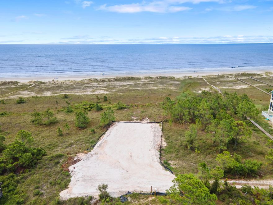 For the discerning buyer ready to build their dream beachfront retreat, this exceptional lot in Port St. Joe offers 70 feet of prime gulf frontage. Spanning .89 acres, this expansive parcel comes with a DEP build permit in place, allowing for the maximum house size possible, ensuring you can create the ultimate beach house paradise. Situated centrally between the vibrant communities of Cape San Blas, Indian Pass and Port St. Joe, this lot offers convenient access to all the amenities and attractions these beloved areas offer. What truly sets this property apart is its unique location bordering the Surfside Estates dune walkover easement, providing unobstructed, panoramic easterly views of the untouched dunes and the shimmering gulf waters. This is a rare opportunity to own a piece of Florida's coveted coastline, where wide beaches, sweeping dunes and endless gulf views create a perfect backdrop for your coastal dream home.