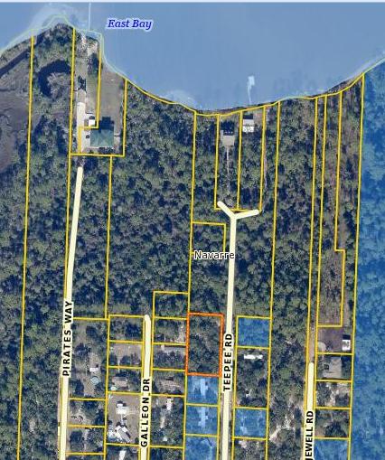Large double sized lot available in Navarre. Mobile homes allowed. Would be perfect for a builder! High and dry.