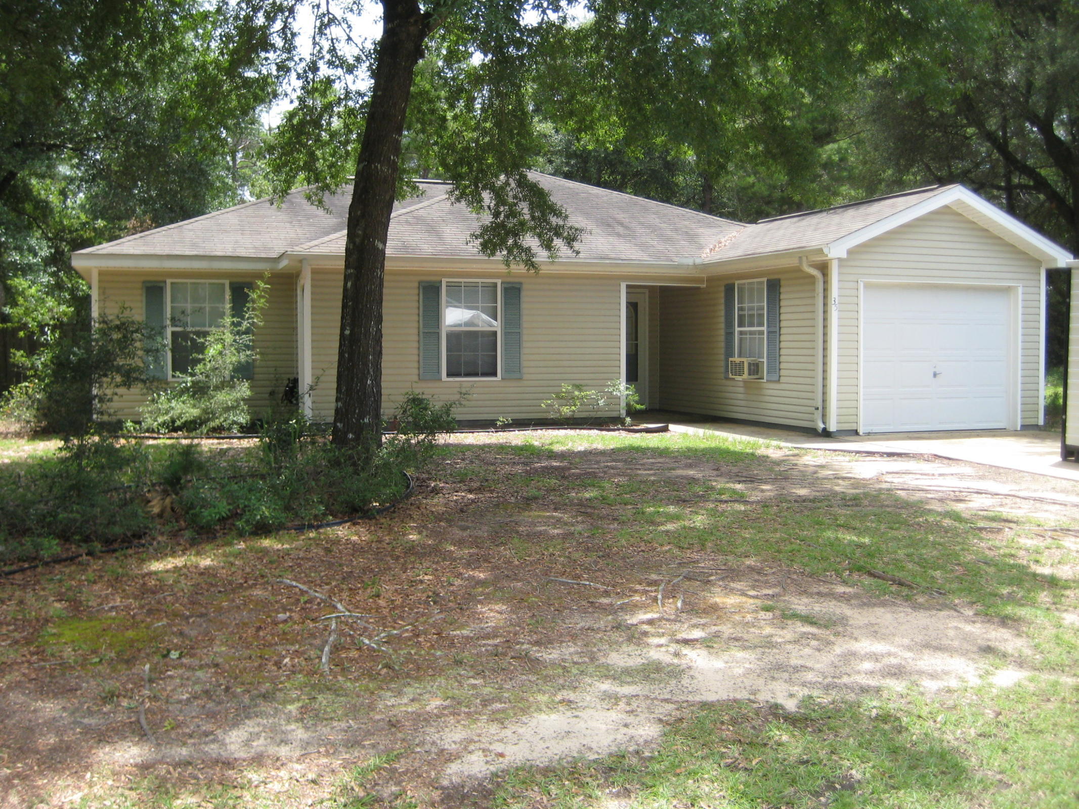 New Roof ! Well maintained 3/2/ on approximately 1/2 acre, looking for a new owner! Home has laminae flooring in living area, kitchen and hall, with carpet in bedrooms. Located on a privacy fenced large corner lot with plenty of shade and privacy. Room sizes and lot dimensions are not exact. Buyer to satisfy themselves with dimensions.