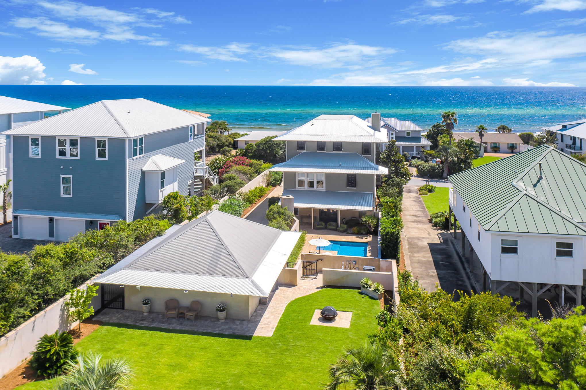 With astounding views of the emerald-green waters of the Gulf and sugar-white sand of the pristine beaches, this beautiful, custom-built 4-bedroom/4.5-bath home in the gated community of Pelican Circle, just south of 30A, provides a unique opportunity to create your own personal coastal oasis. Geographically poised between the renowned Alys Beach and Watersound community, this stunning home offers ample space for entertaining, both inside and out, as well as convenient access to the beach and Camp Creek Dune Lake.  The first floor of the home features 3 guest suites with private bathrooms.  Continuing upward, the second floor houses the main living area of the home, boasting ample windows, French doors, and stunning Gulf views. Here you can enjoy endless sights of the Gulf from the