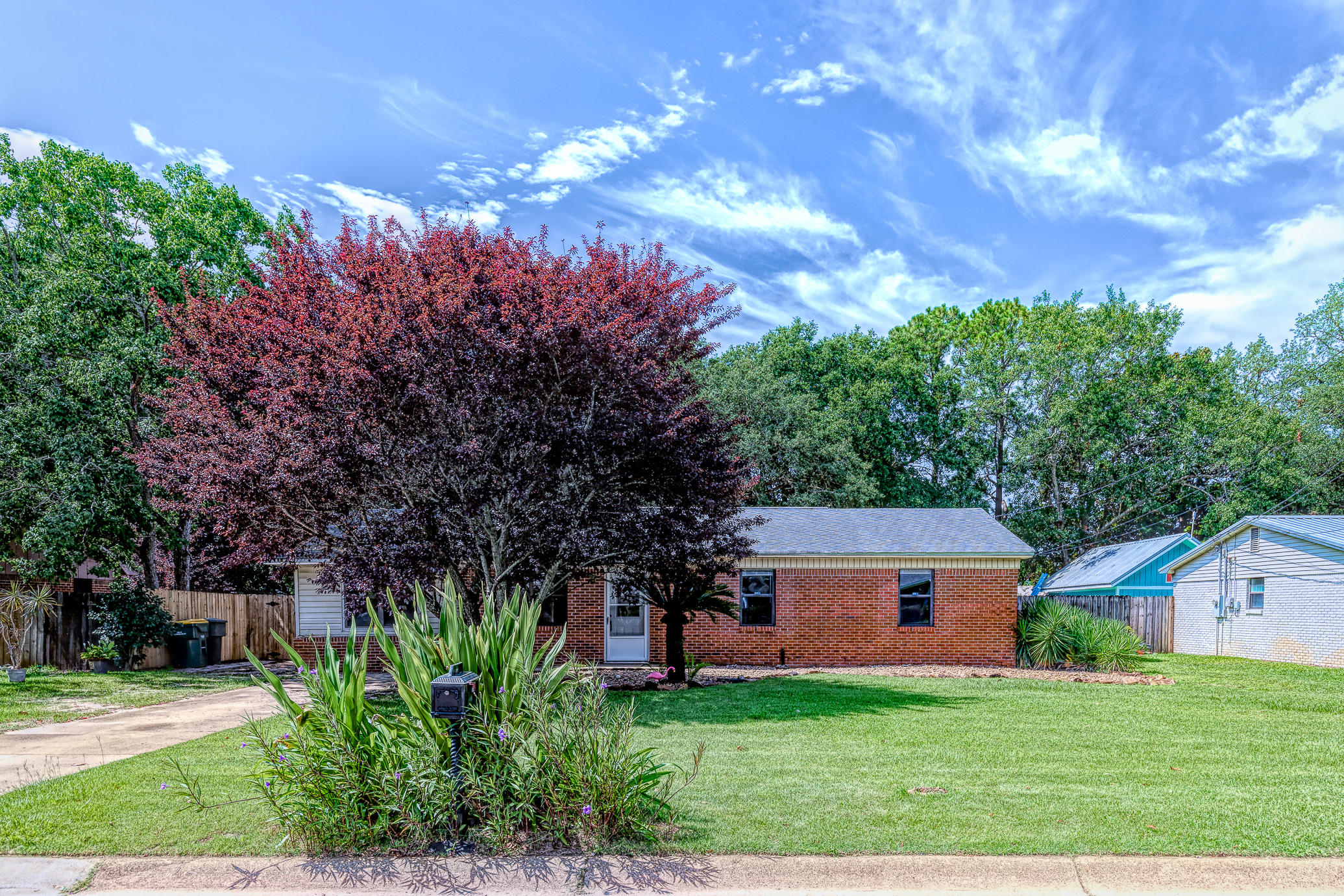 This charming Mid Century Ranch Home will lasso your heart! When you step inside, the living area greets you like a clean, crisp, canvas. Freshly painted walls welcome all your decorative dreams. Beyond the first living area is the spacious Bonus Room that could be your cozy family theatre or a fourth bedroom. The kitchen dining room flow accommodates many guests at once so you can comfortably have family cooking night, or friends over for wine. This home has been updated from head to toe. New tile and luxury vinyl plank throughout, newer HVAC, Water Heater and Plumbing. Enjoy breezy summer nights out on your new backyard deck. Welcome home to Lula Belle Lane.