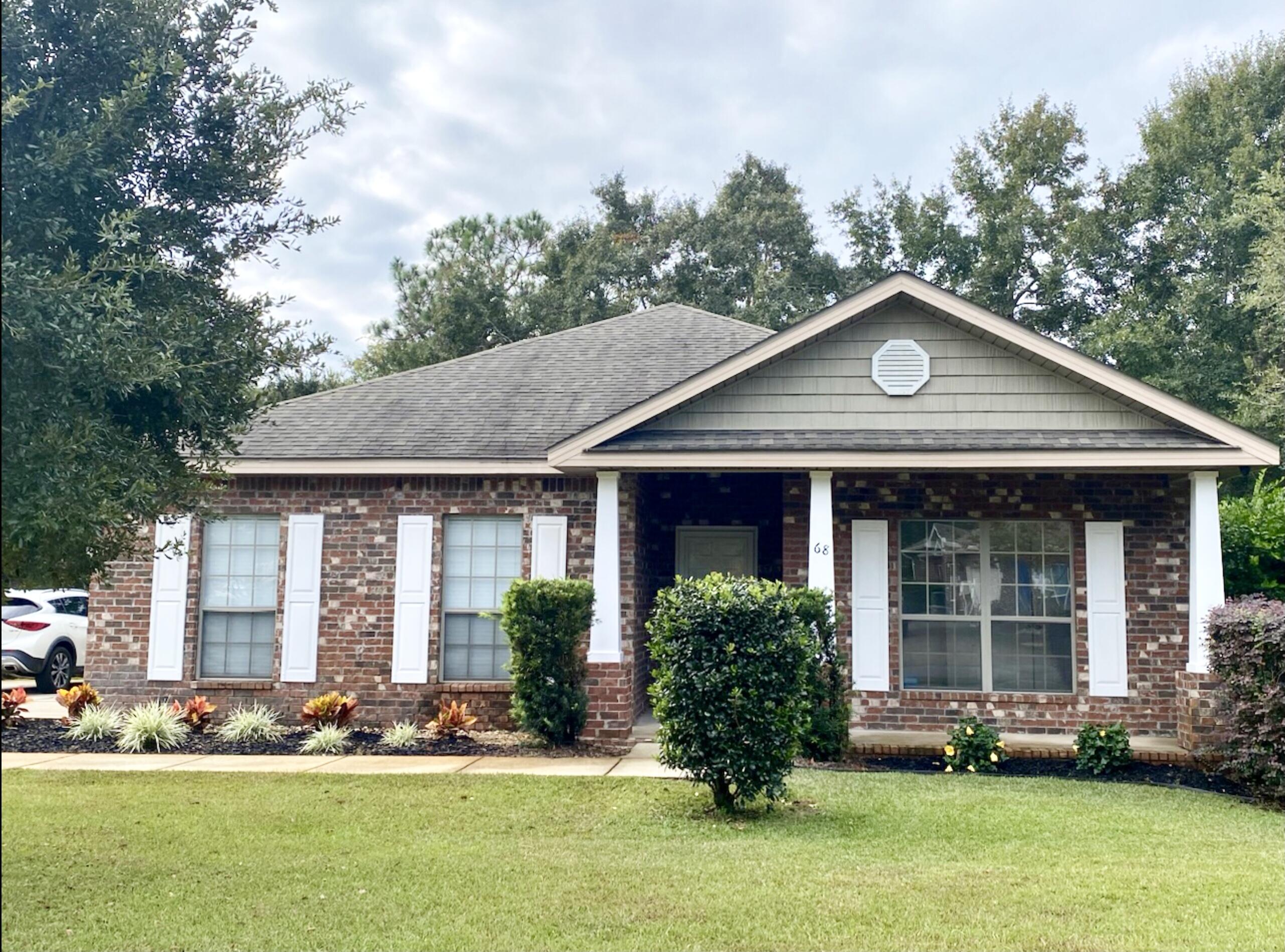 Look no further for your dream home. This 4 bedroom/2 bath all brick home is ready to welcome you. Located in the highly sought-after Hammock Bay community! This beautifully designed residence offers an ideal blend of comfort and convenience, just a short distance to community resort-style pools, a clubhouse, movie theater, fitness center, tennis, pickleball and basketball courts. The community offers events, including movie nights and concerts on the lawn. The split floor plan provides privacy, with a spacious primary suite featuring a luxurious en-suite bath on one side, while three additional bedrooms--one perfect for a home office. Updated master bathroom and no carpet are recent updates. You are sure to enjoy outdoor living on the screened-in patio or relax on the backyard deck in your fully fenced yard. The side-entry two-car garage, soaring 9' ceilings, elegant archways, stainless steel appliances, and granite countertops in both the kitchen and bathrooms add to the home's charm and functionality. Don't miss your chance to live in this incredible community schedule your showing today!