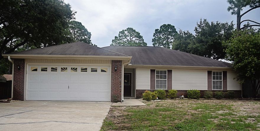 This home will be a pleasant surprise as soon as you open the door! The family room is huge and offers plenty of room for everyone and can hold even the largest furniture or media set up. With the high vaulted ceiling and the light pouring in, it is the perfect place for friends and family to gather. The kitchen is open to the living area, so the cook doesn't miss out on any fun and can keep an eye on the kids while working. The Corian breakfast bar offers an easy place to grab a snack, and the dining area is attached to the kitchen for easy access. The interior laundry is just off the kitchen as you head to the roomy 2 car attached garage. Down the hall are the 3 bedrooms, and the master is large enough for your king sized bed and furniture. The double vanity in the master bath really