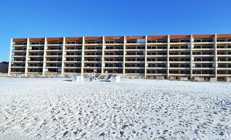 If you are dreaming of BEACH LIFE, TOES IN THE SAND and 6th floor VIEWS....then Surf Dweller #605 would be a dream come true.  Residing directly on the Gulf of Mexico, this condo offers 400 ft of deeded Gulf access and panoramic beach views of white sandy beaches and sparkling water from an expansive 34 ft balcony!   Well appointed, this unit is being sold fully furnished, rental ready and offers a spacious floor plan with approx.1,453 sq. ft. of living space...all that plus a seasoned rental history with many repeat guests on a self- managed rental program with a long list of 5 star VRBO 459264 reviews with  annual income!   This unit features a large kitchen with granite counter tops, lots of cabinets, a breakfast bar, and opens to a generous sized living/dining area.