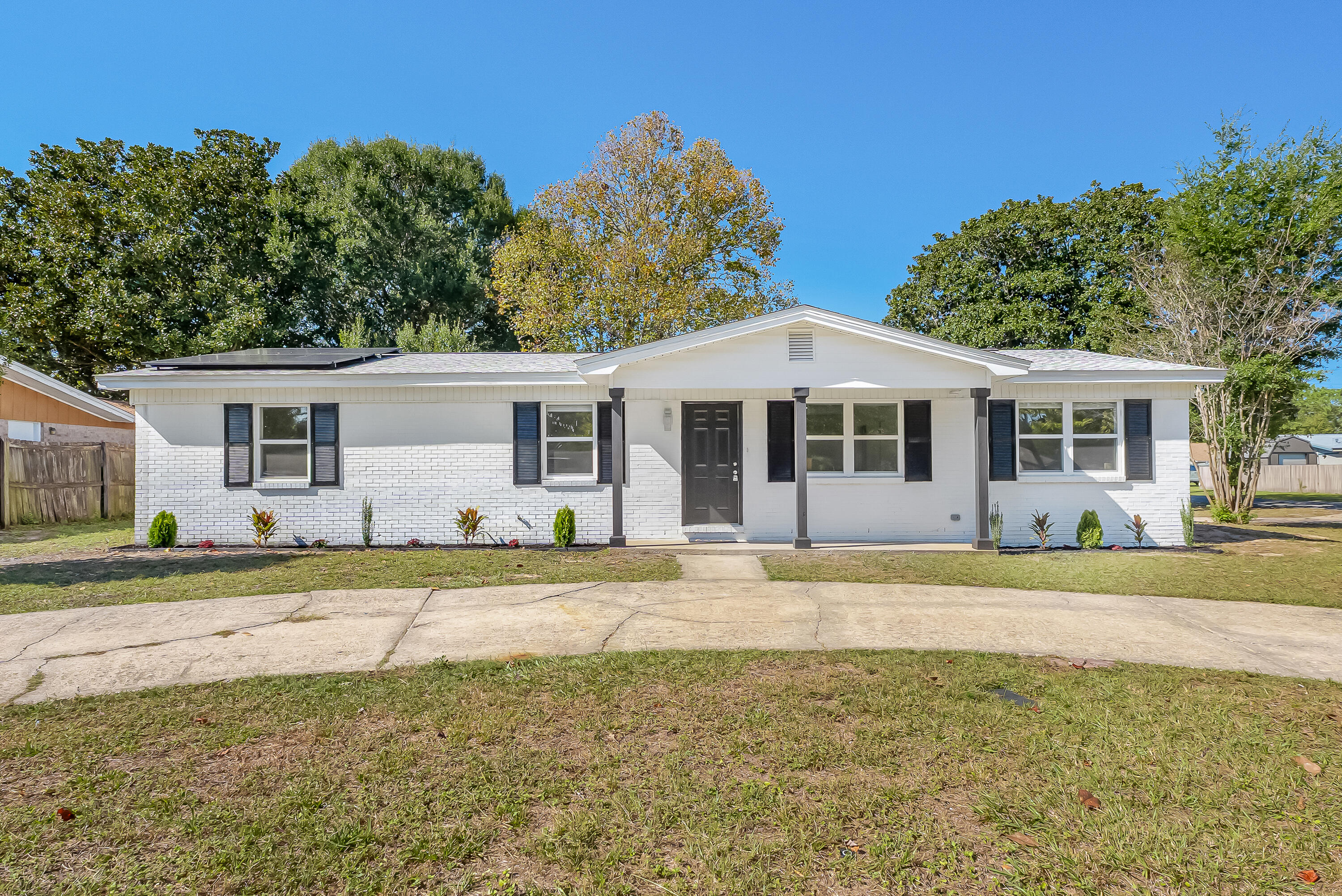 Welcome to this beautifully updated 4-bedroom, 2-bathroom brick home featuring modern upgrades and fully paid-off solar panels! This move-in-ready home offers the ideal combination of comfort, style, and energy efficiency. Inside, you'll find a freshly painted, warm interior with tile flooring throughout the main living areas and one bedroom, plus brand-new carpet in the remaining three bedrooms for added comfort.Bright and inviting, the home features abundant lighting with new low-profile LED fixtures, stylish modern lights, and ceiling fans throughout. The spacious primary suite includes three closets and a private en-suite bathroom, while both full bathrooms have been tastefully renovated with contemporary finishes.Enjoy everyday convenience with a lighted pantry and a large laundry room offering plenty of space for storage and organization. Step outside to the enclosed, screened-in porch overlooking a privacy-fenced backyard, perfect for family gatherings, weekend barbecues, or quiet morning coffee.
The one-car garage provides additional space for a workbench and features a freshly epoxied floor. There's also ample parking with two separate driveways, including a convenient circular drive. A brand-new water heater and fully paid-off solar panels offer peace of mind and long-term energy savings.
This home truly has it all, modern style, thoughtful updates, and sustainable living, ready for you to move in and make it your own!