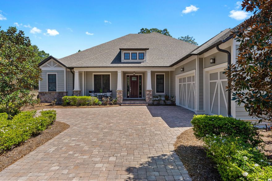 This beautiful Arthur Rutenberg home is a single story home with 3 bedrooms and 3.5 baths, a summer kitchen, saltwater pool with lanai & perfect for entertaining. Looking to escape the hustle and bustle of 30A and all the traffic? You won't find another home like this one. Wild Heron is a gated neighborhood situated around a Greg Norman favorite, Sharks Tooth golf course & Florida's largest coastal dune lake, Lake Powell & Resort style amenities. Perfectly situated between 30A & Pier Park then this is the perfect place to call home. Come see why they call it a coastal sanctuary!