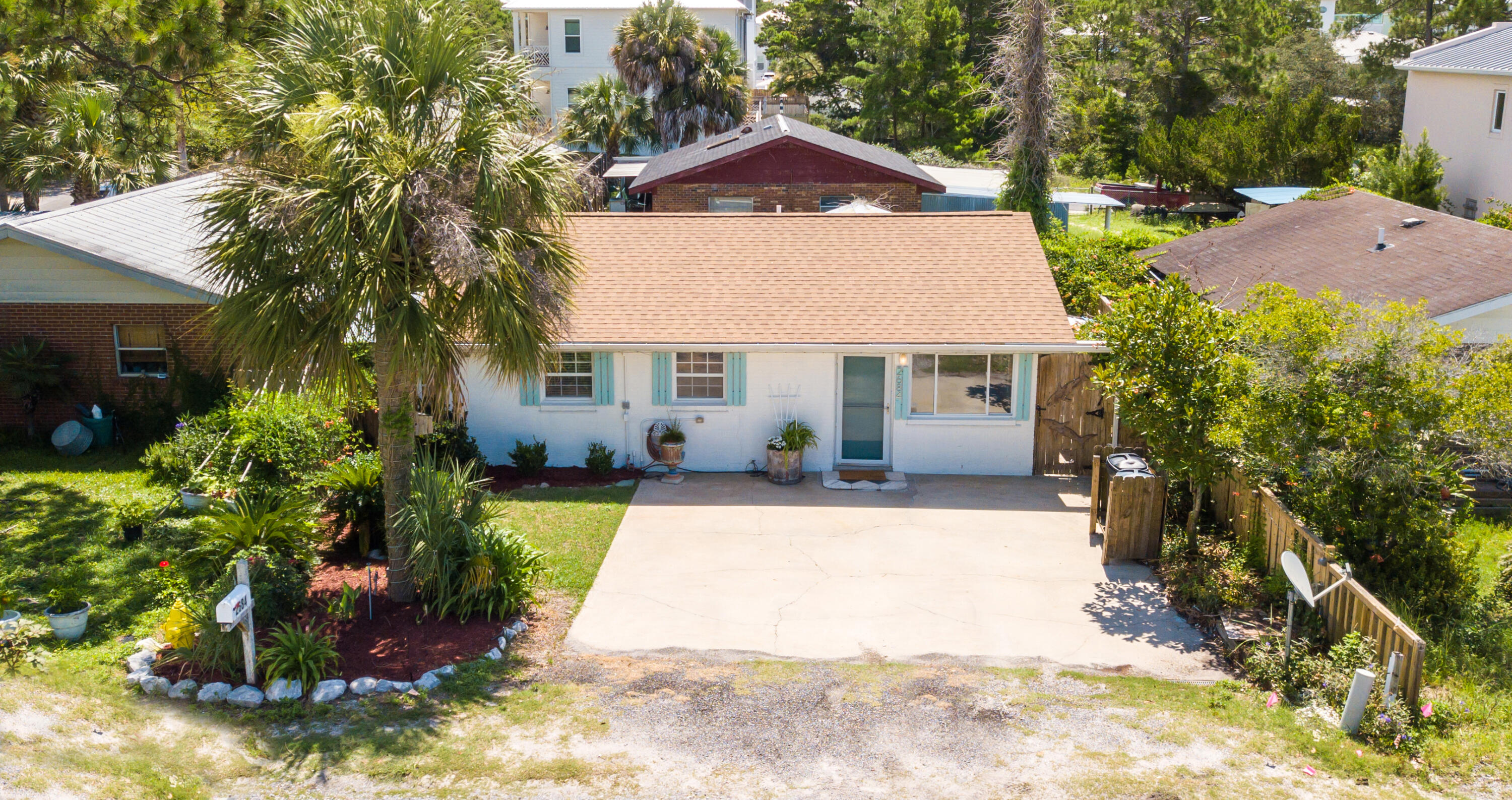 2ND BEST PRICED HOME ON 30A! AMAZING STARTER HOME OR RENTAL INVESTMENT. NO HOA. Charming 3br Florida cottage in the heart of Blue Mountain Beach for an incredible value! This is a prime location directly on 30A within 1/2 mile to the beach, Gulf of Mexico and many dining & entertainment options. Blue Gulf Resort is a great no HOA community with no rental restrictions. This one level home is easy to maintain, has a new roof in 2019, updated electric & Rinnai tankless gas hot water heater. Interior was just freshly painted throughout, partial new exterior paint, bathroom updated & new landscaping & bahama rock around the hot tub. There is a great outdoor back patio, ideal for relaxing or dining al' fresco. Interior features vinyl flooring, granite countertops in the kitchen & breakfast bar. The kitchen has an add-on allowing for interior laundry or dining which makes the home more functional. The living area opens up nicely to the kitchen making entertaining easy. Kitchen offers granite countertops and breakfast bar ideal for casual dining. Kitchen is nice and bright with the white cabinets and appliances and ample storage. Additional features include undermount lighting & foot lighting for an added ambiance and a water filtration system. The kitchen add-on added another approximate 100 square feet and could second as a dining or bar area along with the laundry area. The primary bedroom features an en-suite half bath which is a nice convenience. There are two guest bedrooms and a main bath that was recently updated with new vanity & lighting and added shiplap for a contemporary touch. This features a walk-in aromatherapy tub for pure relaxation. All bedrooms feature mirrored closet doors. This is the perfect cottage for relaxed beach living and can be a great rental investment, primary or second home.

Blue Gulf Resort is a prime location in Blue Mountain close to many conveniences - the bike & pedestrian path is right outside your door along with The Village commercial to include Mimmo's, a coffee and ice cream shop, Real & Raw and Thai 30A. Also nearly is For the Health of It local grocery, Blue Mountian Bakery, Bike Daddy's Bike Shop, McTighes, Shunk Gulley and even Grayton Beach State Park in close vicinity. Access the beach just over 1/2 a mile away. The nearest public access is at the south end of Highway 83 with parking and restrooms but there is also an additional access across the street behind Redfish Circle that this community has an easement to access.

Blue Mountain Beach is the highest elevation of Florida's Gulf Coast lending incredible views and beautiful natural dunes and wild flowers. Enjoy the great outdoors with the surrounding state parks, nature trials and the 22-mile bike & jogging path. Kayak or paddle board on one of the rare coastal dune lakes and experience a unique ecosystem that is only available to approximately 5 locations in the world! The picturesque towns of Seaside, WaterColor and Rosemary Beach are just east. Do not miss out on this incredible opportunity to own a historic 3-bedroom "Brickyard" home in a prime location close the beach!