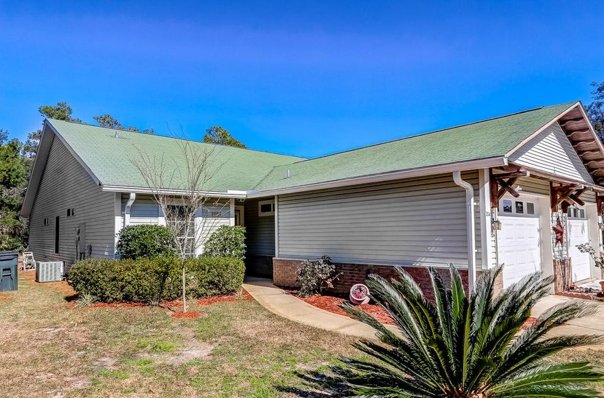 Meticulously maintained townhome located near the end of a cul-de-sac and the community swimming pool. The owner has installed new energy-efficient windows, laid new tile in the separate laundry room, kitchen and two bathrooms, new laminate flooring in all 3 bedrooms & new carpet in the living/dining area. Buyers' peace of mind assured knowing the Rheem A/C-heat pump is newer, as is the GE stove, Kenmore dishwasher, Kenmore refrigerator, garbage disposal and garage door. Kitchen countertops have also been replaced. New countertops and cabinets were installed in the laundry room & new lighting fixtures were installed in the kitchen and dining room. The covered back patio has been extended and opens to a large wooded back yard that connects to 30A nature trail.