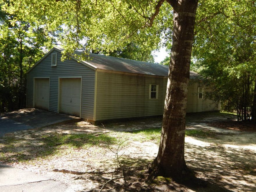 A beautiful home site in an area upscale homes. Only a few minutes to downtown Crestview, yet secluded. This property has been surveyed by the seller and includes the division of a 2 acre site into 2 parcels. The 24x48 outbuilding will be included in the sale of this land. It is a wonderful building with concrete floors. The land will come with restrictions stating'' on site built'' homes only. No trailers, or mobile homes or off-site built homes will be permitted on this property. It is a wonderful piece of property with a great workshop/ storage building. The building is almost worth the price of the land! Hurry and take a look at this property! . See MLS # 744190 adjoining land. The entire land with 2 buildings can be bought for $82,500. This is a great investment and rare find!!