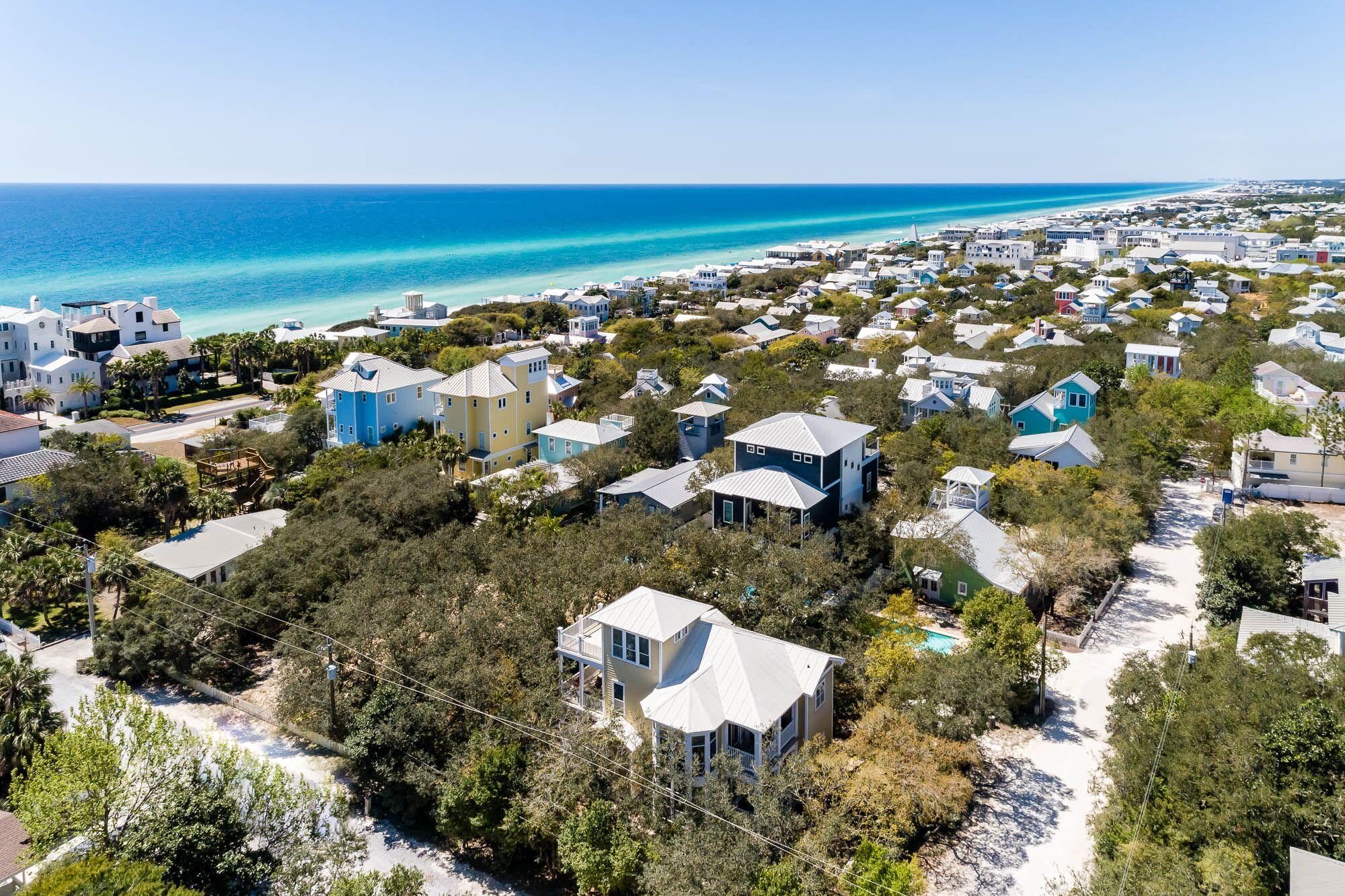 Unique opportunity to own a Florida Cottage on a double lot PLUS two adjacent vacant lots within steps of Seaside & the beautiful beaches of South Walton in Old Seagrove. Gulf views and an easy walk to the beach & 30a.