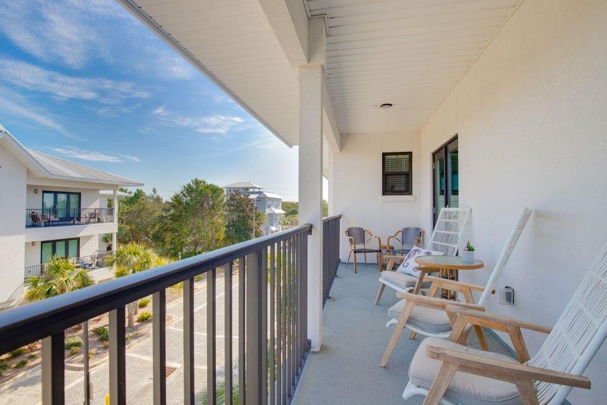 Nestled between picturesque Blue Mountain Beach and Gulf Place on 30A, Hidden Lake Condominiums offers a blend of modern luxury and beachside tranquility. This gated community offers new and stylish buildings constructed in 2020 and resides approximately three blocks from the beach, accessible via both Spooky Lane or Gulfview Heights Road. The condominium features a beautiful zero-entry pool and a charming fitness center, enhancing the living experience. Each unit boasts nine-ft. ceilings, granite countertops in the kitchen and baths, and Numa balcony doors, among other upscale finishes. The modern VPL flooring throughout adds to the contemporary feel. This particular unit, a three-bed, three-and-a-half bath residence, is notable for its triple master suites with ensuite baths, a spacious