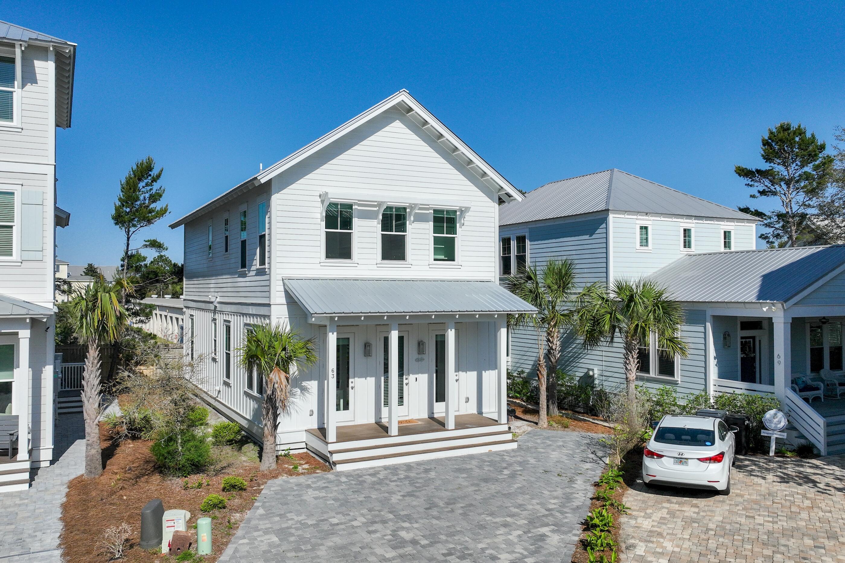 Prominently positioned just a few homes back from the renowned turquoise hued waters, 63 Sawgrass is the idyllic retreat perfect for those Seaside getaways. Nestled in the private enclave of the Cottages at Seagrove, this newly constructed residence offers a stately paver driveway leading to a charming coastal facade. The heart of the home immediately welcomes you with a sophisticated living space meticulously designed for both relaxation and entertainment. The gourmet kitchen encompasses custom cabinetry coupled with stunning quartz countertops, an oversized kitchen island with integrated seating, and a luxury appliance suite with a gas range. The first-floor primary is graced with natural light and offers a beautifully tiled wet room with soaking tub and walk-in shower. A second floor living area, a true rarity throughout the local market, offers a seating area with TV and is the perfect place for additional lounging quarters. Two spacious guest suites with ensuites and an additional primary suite overlooking the community's lush vegetation complete the second level.
The sought-after community provides residents with a quick two-minute walk to the beach, heightened privacy, and an array of amenities while remaining geographically poised near all of the acclaimed dining and entertainment venues 30A has to offer including the newly opened Greenway Station town center. Inquire today to arrange a viewing and start envisioning the coastal lifestyle you deserve.
With impressive rental potential - annual revenue projections exceeding $75,000 - and its fully furnished, turnkey configuration, 63 Sawgrass is a compelling opportunity for investors and second or full-time residents alike. Schedule a private viewing today and start living the coastal lifestyle you deserve.
