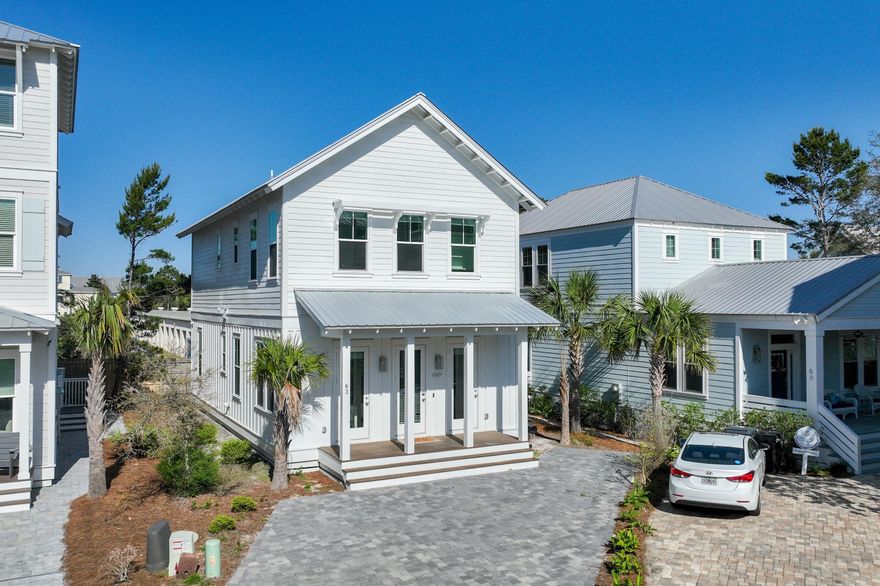 Prominently positioned just a few homes back from the renowned turquoise hued waters, 63 Sawgrass is the idyllic retreat perfect for those Seaside getaways. Nestled in the private enclave of the Cottages at Seagrove, this newly constructed residence offers a stately paver driveway leading to a charming coastal facade. The heart of the home immediately welcomes you with a sophisticated living space meticulously designed for both relaxation and entertainment. The gourmet kitchen encompasses custom cabinetry coupled with stunning quartz countertops, an oversized kitchen island with integrated seating, and a luxury appliance suite with a gas range. The first-floor primary is graced with natural light and offers a beautifully tiled wet room with soaking tub and walk-in shower. A second floor living area, a true rarity throughout the local market, offers a seating area with TV and is the perfect place for additional lounging quarters. Two spacious guest suites with ensuites and an additional primary suite overlooking the community's lush vegetation complete the second level.

The sought-after community provides residents with a quick two-minute walk to the beach, heightened privacy, and an array of amenities while remaining geographically poised near all of the acclaimed dining and entertainment venues 30A has to offer including the newly opened Greenway Station town center. Inquire today to arrange a viewing and start envisioning the coastal lifestyle you deserve.

With impressive rental potential - annual revenue projections exceeding $75,000 - and its fully furnished, turnkey configuration, 63 Sawgrass is a compelling opportunity for investors and second or full-time residents alike. Schedule a private viewing today and start living the coastal lifestyle you deserve.

