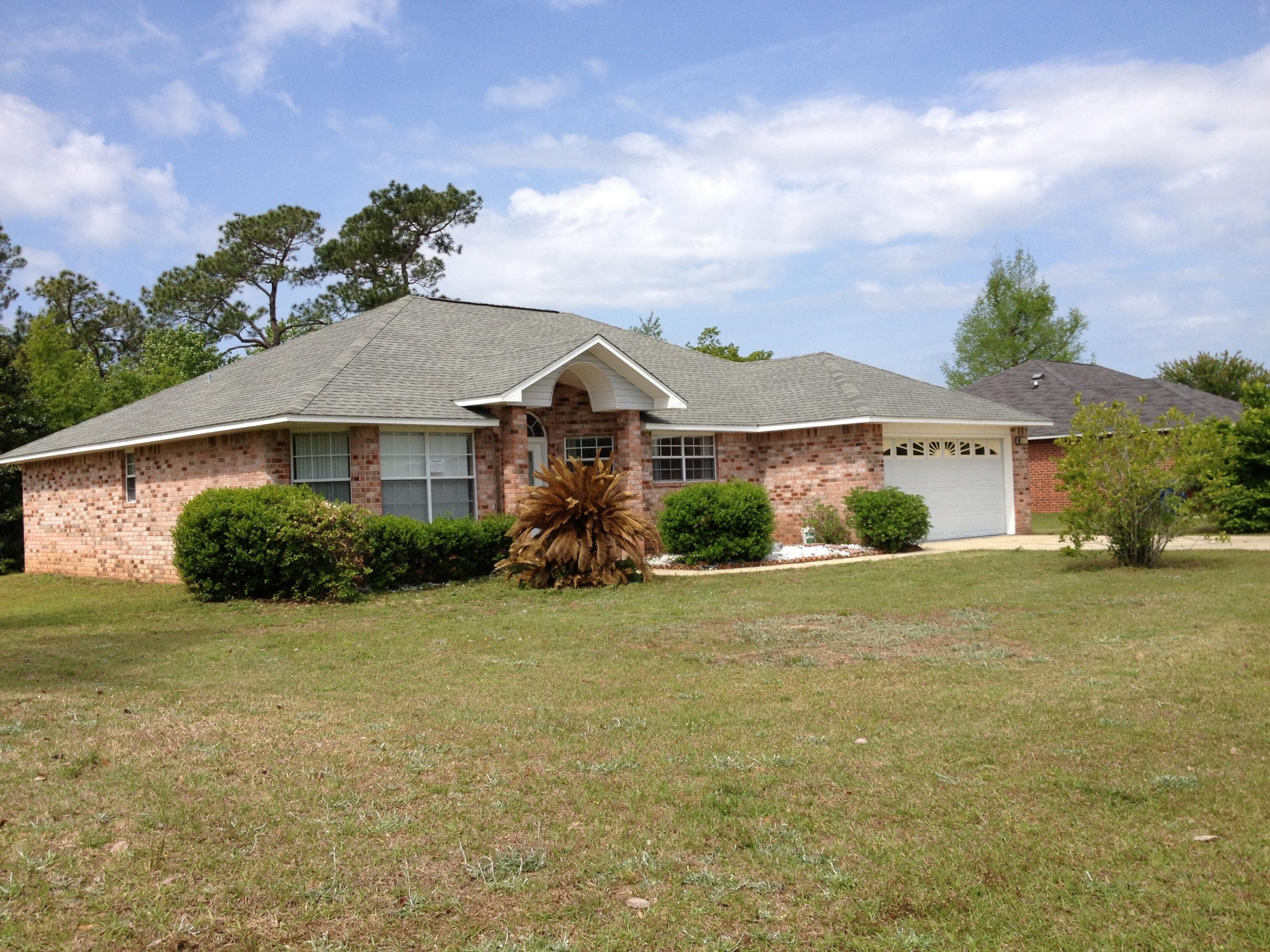 Refreshed all-brick home on one of the largest lots in the subdivision (almost a full acre). Brick columns and decorative glass front door with large fanlight above make a wonderful first impression. To the left of the tile foyer is the formal dining room with large windows that let in abundant sunlight. To the right is the large eat-in kitchen with center island and wrap-around cabinets that provide ample counter and cabinet space. There is plenty of natural light here as well thanks to the skylight above the island. The living room boasts tall plant shelves and a corner fireplace perfect for chilly evenings. French doors lead to the enclosed back patio. The master suite is just off the living room and offers dual vanities, a garden tub, and two walk-in closets. The walls have all