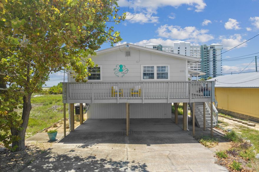 CURRENTLY UNDER CONTRACT, SELLER WILL CONSIDER BACKUP OFFERS Located just walking distance to the beach, this well maintained, fully-furnished 3 bedroom 2 bathroom home would make an excellent vacation home or investment property. In 2021 it  made $52,879 and in 2022 made $64,835 in rental revenue including multiple stays by the owner and no HOA. Newly renovated with vinyl plank flooring, new stainless steel appliances, freshly painted inside and out, and a brand new roof, replaced in 2020. Enjoy ocean views from your freshly painted wrap around deck. Large bonus room downstairs great for entertaining, enjoy a game of ping pong or darts and plenty of room for storage. Don't miss out on this rare opportunity to own your very own slice of paradise.