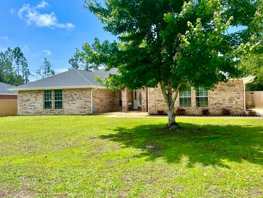 Welcome home~Located on a 100 x 200 lot in Holley By The sea~offering 4 bed / 2 bath and nearly 2700 sq .ft. of true family living space~Large family room with wood look LVP flooring & tiled focal point fireplace ~ Eat -In kitchen has a center Island ,plenty of cabinet & countertop space with french doors out to the extended patio & screened in porch .Master suite with double vanity ,separate tiled shower & deep soaking tub .3 additional b/rooms are all a good size.All this and the home still offers a formal dining room and office/den space. Laundry room has plenty of space for additional storage & leads out to your 2 car side entry garage.Long driveway offers lots of parking and a double gate through to the additional parking pad for your boat or RV.Roof replaced in 2021.A/C in 19 .W/H 16 Enjoy all the amenities that Holley by the Sea has to offer which includes the recreation center, pools, tennis courts, ,pickle ball, playground, gym and and access to Santa Rosa sound