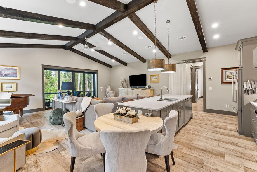 PRICE REDUCED! This custom home at the beach exudes architectural beauty and modern coastal elegance. Conveniently located on the west end of Highway 30A, you'll be just a short bike ride from Gulf Place and several public beach accesses. Built in 2016 with ICF construction (concrete), you'll enjoy a solid home with concrete tile roof, whole home generator, 3-car garage, ample parking, room for a pool with deck and NO HOA. Short term rentals are allowed in this area and rental projections at $135,000 - and higher with the addition of a pool.At the end of a quaint cul-de-sac, the home features a large pavered driveway, modern glass front door and backs up to a quiet wooded area. As you walk in the front door, you're greeted by a stunning brick archway hall and modern coastal lighting.