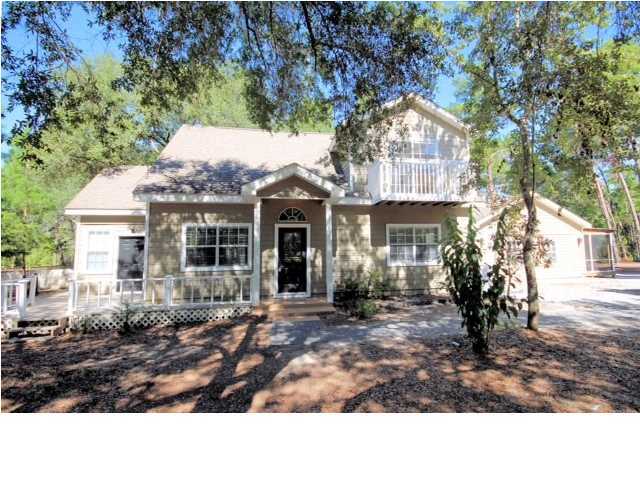 PRICE REDUCED ...! This custom built home sits on almost ? an acre of pristine property in South Walton. Conveniently located to Sacred Heart Hospital, Grande Blvd shopping center and the beautiful beaches our area has to offer. Inside you will find gorgeous granite countertops within a spacious open kitchen, brand new carpet throughout, a fabulous screened in porch with hot tub, an attached 2 bedroom mother in law suite with a full kitchen.Sold As-is. Call today to schedule a showing.