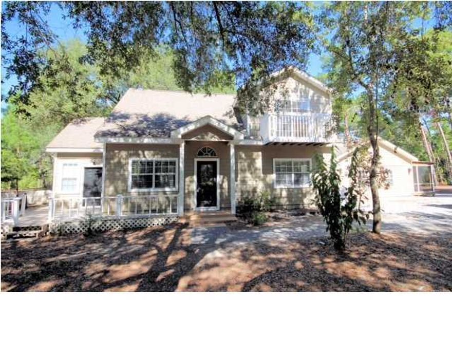 PRICE REDUCED ...! This custom built home sits on almost ? an acre of pristine property in South Walton. Conveniently located to Sacred Heart Hospital, Grande Blvd shopping center and the beautiful beaches our area has to offer. Inside you will find gorgeous granite countertops within a spacious open kitchen, brand new carpet throughout, a fabulous screened in porch with hot tub, an attached 2 bedroom mother in law suite with a full kitchen.Sold As-is. Call today to schedule a showing.