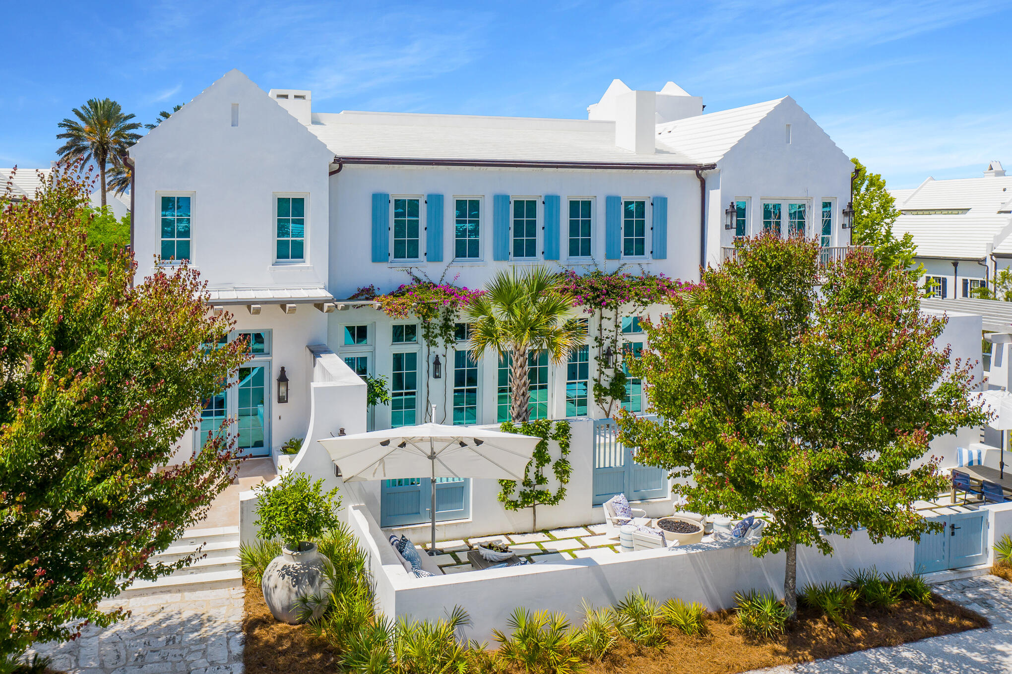 RECORD HIGHEST PRICE PER SQ FT OF ANY HOME SALE ON NORTH SIDE ALYS BEACH. Poised prominently on a corner site along the pedestrian path, this Alys Beach residence presents sophisticated luxury living on the coast. Aptly named ''Bougainvillea'' for the brightly colored flowers that charmingly adorn the front side of the house, the residence was designed by renowned architect David Stocker of SHM Architects. A spacious open design with high ceilings & walls of windows give way to an abundance of natural light. The main floor features a spacious living area & a fully appointed chef's kitchen & elegant dining area. Also conveniently located on the first floor is a guest bedroom with full bath. The second floor hosts a comfortable flex space room, the master suite, and two additional guest