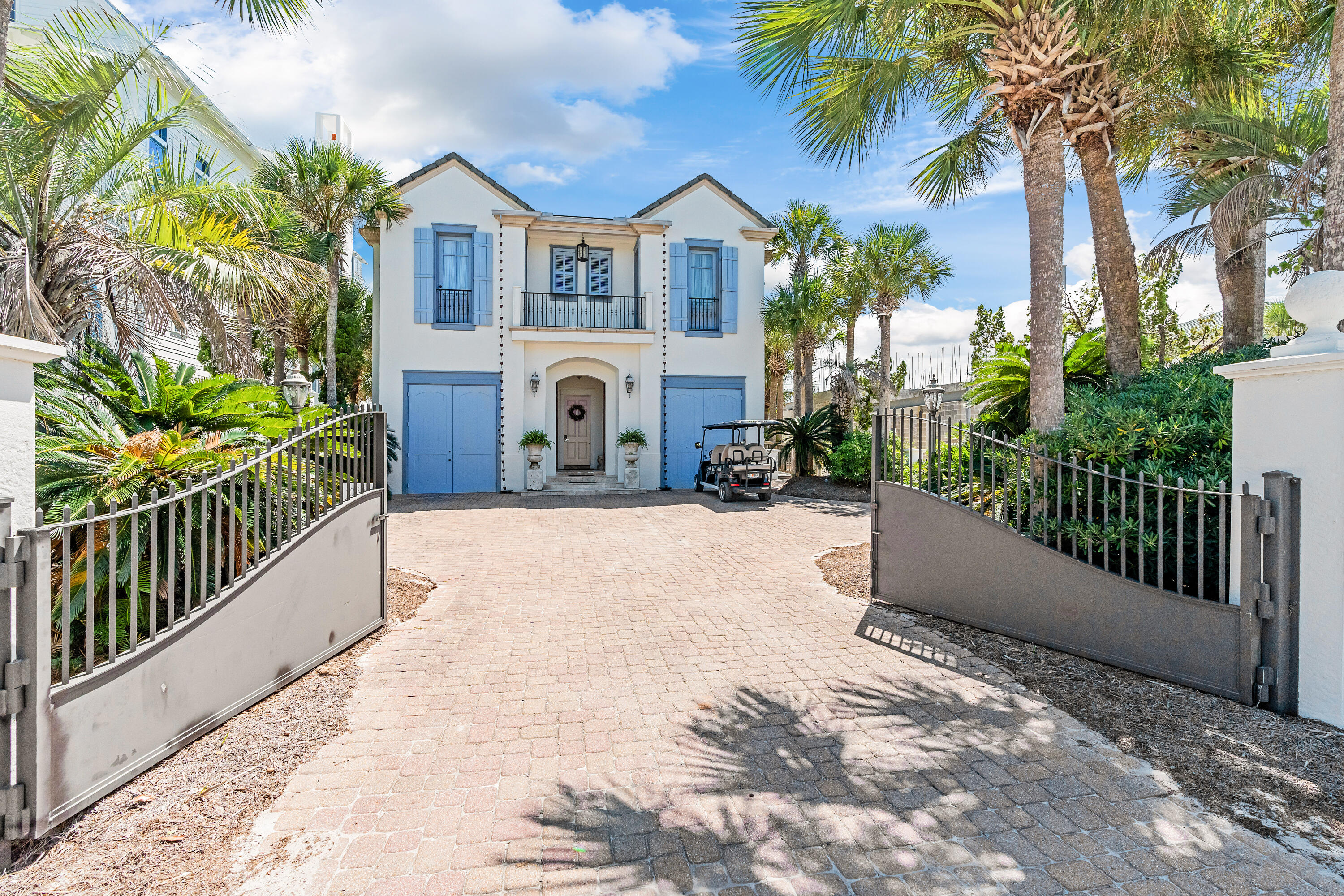 Incredible panoramic views of the Gulf and Eastern Lake... prepare to be swept away by this French Caribbean inspired Gulf Front home designed by acclaimed architect, Tom Christ, and New Orleans Interior Designer, Patrick Dunne. 'Chez Fleur' was notably featured on HGTV's 'Homes Across America.' Timeless and beautiful details intrigue at every turn, from the soft colored textured plaster walls that reflect light at different times of the day to a gorgeous portico entry and circular vestibule leading to a light-filled hall with twin courtyards on either side. The gated entrance ensures privacy; the most charming antique reclaimed hardwood floors and the wood staircase with cast bronze baluster ''wows.'' The first floor offers two guest suites just off the vestibule. Gulf views draw you to the south side of the house where three sets of French doors leading onto a wide porch welcome dining al fresco or soaking up gulf breezes and sunsets. A brand new heated pool and spa can be enjoyed year round! The living room with a large fireplace and generous dining space elegantly span the entire back of the home. Adjacent to the dining area is the French-styled kitchen with Alabama marble countertops. From the kitchen, walk out onto the eastern courtyard for grilling on the natural gas grill. Over on the western courtyard is an outdoor shower and access to the private beach walkover via a newly rebuilt boardwalk. A half bath services the lower level near the laundry. Upstairs are two matching guest suites with private baths, a large bunk room, and a spacious Gulf front master with wood-beamed ceiling, two walk-in closets and a master bath with dual sinks and a multi head shower. Three sets of French doors lead to a private covered porch with incredible panoramic vistas. On the north side of the home, opposite the master suite at the end of a comfy common area, are the two identical spacious guest suites, each with views of the Gulf. A second-floor full bath services the common area and bunkroom. The home offered furnished with a mix of contemporary furniture and imported antiques, including a pastry table from a French chateau. Buyer is responsible for personally verifying details about this property. Any information contained in this listing is believed to be accurate but is not guaranteed.