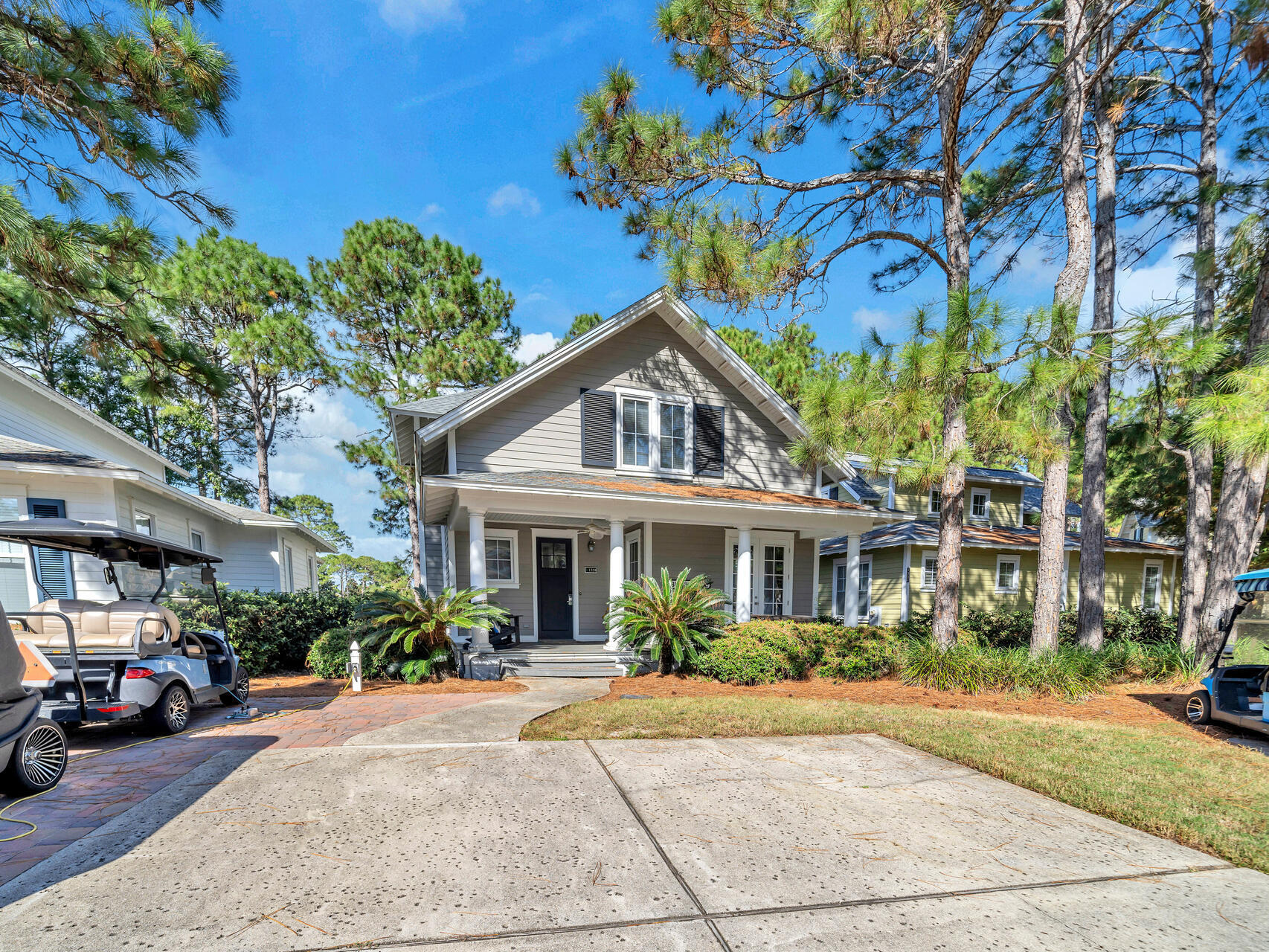 This charming 3BR/3.5BA Florida cottage is within the popular neighborhood of Laurel Grove. You can sit on your screened back porch and watch the golfers go by as they play the 3rd hole of the Raven Golf Course. Meant for entertaining, this home is spacious and inviting with a large living area and master bedroom downstairs and upstairs is a loft area and two additional bedrooms. It is just a short walk to the pool and clubhouse which has a fitness center and full kitchen. This home is being sold furnished with a few exclusions and WITH A FOUR SEATER GOLF CART. In 2022 the exterior and interior of the home were painted as well as a NEW roof. Move in and use as a permanent residence, second home or as a short term vacation rental. Sandestin has 4 golf courses, tennis and pickleball courts, walking and biking trails and beachfront property. The Village of Baytowne Wharf offers great opportunities for shopping and dining. Grand Boulevard is just a short golf cart ride away for more high end shopping and a variety of restaurants. You will also find a Publix grocery at Grand Boulevard for your convenience. The sellers had extra pavers installed for golf cart parking so two cars can still park in the driveway. There is also a charging station for the golf cart. 