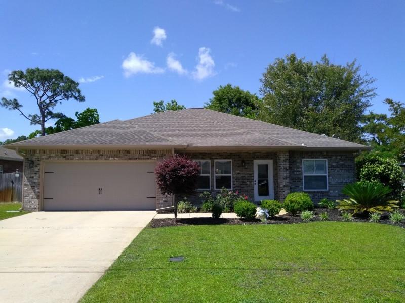Come and see this upscale custom all-brick home featuring an open-concept design with a spacious kitchen and great room, separate dining room, four bedrooms, and two baths. The gourmet kitchen showcases granite counter tops with a hop-up bar, custom maple cabinets, porcelain tile flooring, stainless steel appliances including a built-in microwave, dishwasher, smooth cook-top stove and a unique professional style refrigerator and freezer that you MUST SEE! The luxurious great room features crown molding around high ceilings, expanded baseboards over hardwood floors, and easy access to a fully-landscaped and fenced back yard. 6 miles to front gate of Hurlburt Field and close proximity to beach.