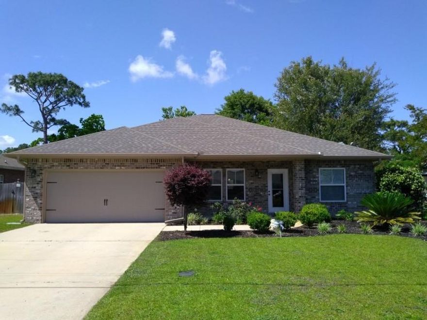 Come and see this upscale custom all-brick home featuring an open-concept design with a spacious kitchen and great room, separate dining room, four bedrooms, and two baths. The gourmet kitchen showcases granite counter tops with a hop-up bar, custom maple cabinets, porcelain tile flooring, stainless steel appliances including a built-in microwave, dishwasher, smooth cook-top stove and a unique professional style refrigerator and freezer that you MUST SEE! The luxurious great room features crown molding around high ceilings, expanded baseboards over hardwood floors, and easy access to a fully-landscaped and fenced back yard. 6 miles to front gate of Hurlburt Field and close proximity to beach.