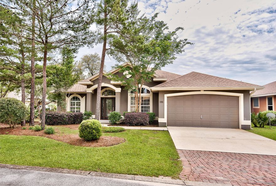 This move-in ready home set on a corner lot within the Chardonnay Estates neighborhood of Niceville is conveniently located near the Mid-Bay Bridge. Popular shopping, dining, and Destin's renowned beaches are little more than ten minutes away by car. Flanking its leaded glass front entry door are the formal dining room and home office. Recessed lighting illuminates the voluminous living area with high ceiling and gas fireplace accented by a large display niche. Plush new carpet can be found in the living and dining rooms, as well as in each bedroom. Overlooking the living room is a modern kitchen with richly stained wood cabinets, dark granite counters and stainless steel appliances.