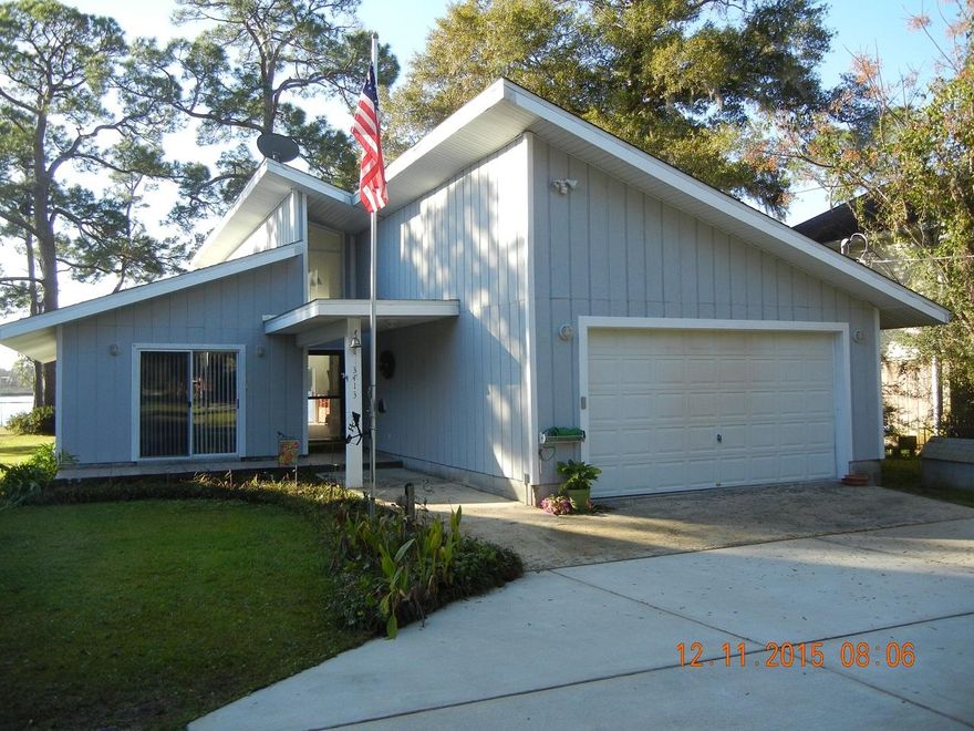 Instant equity on reduced price based on recent appraisal. Home designed by owners for comfort and casual elegance. Facing the East Bay, enjoy the gorgeous sunsets from your back deck, living room, or Master Bedroom. Park your RV on the spot provided. Park your boat or jet ski by your 150' dock. Plenty of land on 1.9 acres to add to property. Great neighbors and ideal location: only 4 miles from Hwy 98; 5 miles from the white sand beaches of the Gulf! New roof. Better than a Condo: no HOA fees! Make an offer today!