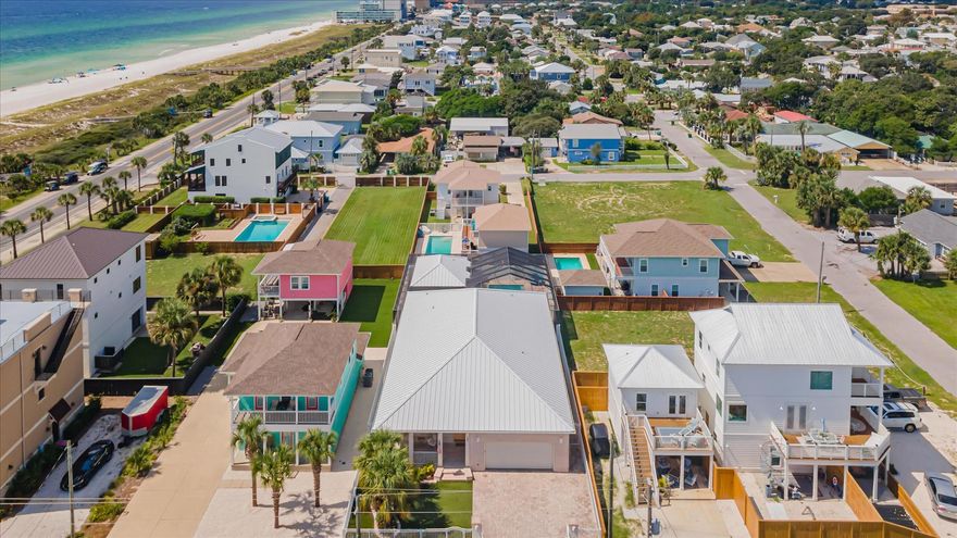 INSTANT EQUITY! Home appraised for $1.5 million last week. A must see beach property! Nestled in the heart of Panama City Beach, step inside this exquisite beach residence that offers a lifestyle of unparalleled sophistication and serenity. Boasting a prime location with direct access to the pristine sands, this stunning pool home is a true oasis. Once you step inside you are greeted by a gourmet chef's kitchen, designed to impress with high-end appliances and elegant finishes; along with custom cabinets, bamboo and tile flooring, wet bar, inlaid ceilings, fine wood finishes, and more. The spacious living areas are bathed in natural light, creating a warm and inviting atmosphere. Indulge in the luxury of a fully screened in private pool, perfect for entertaining guests or simply r Boasting a prime location with direct access to the pristine sands, this stunning pool home is a true oasis. To add to the pristine residence, an additional 470 sqft. 1 bedroom detached pool house or mother-in-law suite with kitchen and full bathroom are sure to please any guests and add to the excitement while living the beach life. 
Enjoy the convenience of private beach access, just steps from your doorstep. With the only private beach access in Panama City Beach, Bid-A-Wee subdivision offers 5 gated beach accesses for the community use.

Recent Upgrades:
Artificial Turf front and back of home.
Freshly painted interior.
New AC Units in the main and pool house.
New ceiling fans replaced on front and back patios.
New ceiling fans and lighting fixtures in the living room, dining and master bedroom.
Upgraded pool equipment.
Garage floor epoxied.

This exceptional property offers the perfect blend of luxury, comfort, and convenience. Don't miss this opportunity to own your dream home in one of the most desirable locations in Panama City Beach!