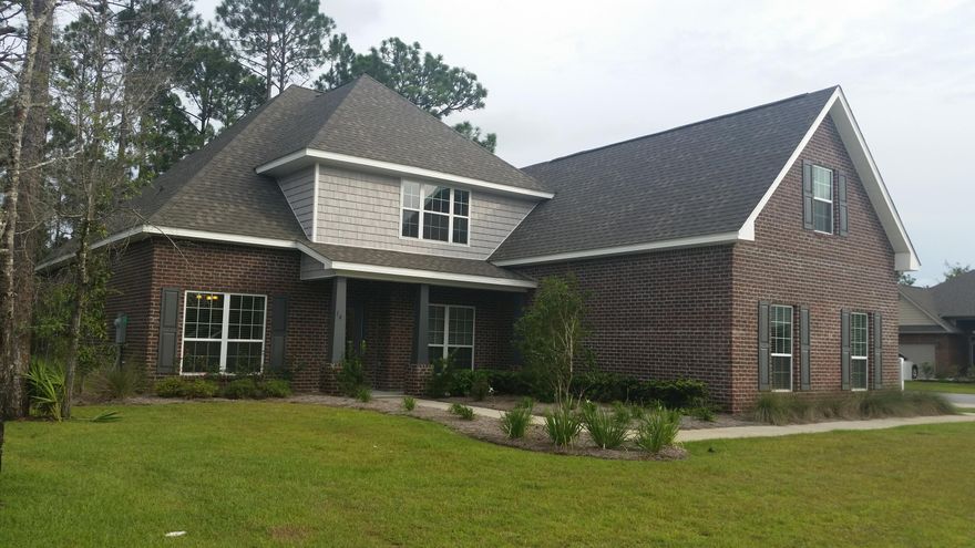 Peach Creek Model home now for sale! The ''Wyngate'' is a spacious, open home with great natural lighting. Picture the family gathered around the fireplace or a great night of entertaining in your new home! Recessed can lighting throughout, stainless steel GE appliances, Hardwood in Master Suite and closet, Family room, Dining, Study, and Oak wood treads on stairs leading to a FANTASTIC BONUS ROOM that would make a PERFECT entertainment area, movie room or playroom. Full Bathroom and additional bedroom upstairs for guests. Home features front porch and covered, screened back patio, Irrigation system with well, Granite kitchen counter tops and vanities, spacious porcelain tile shower in Master bathroom with Garden tub for relaxing. In addition, home features builder warranties and closing